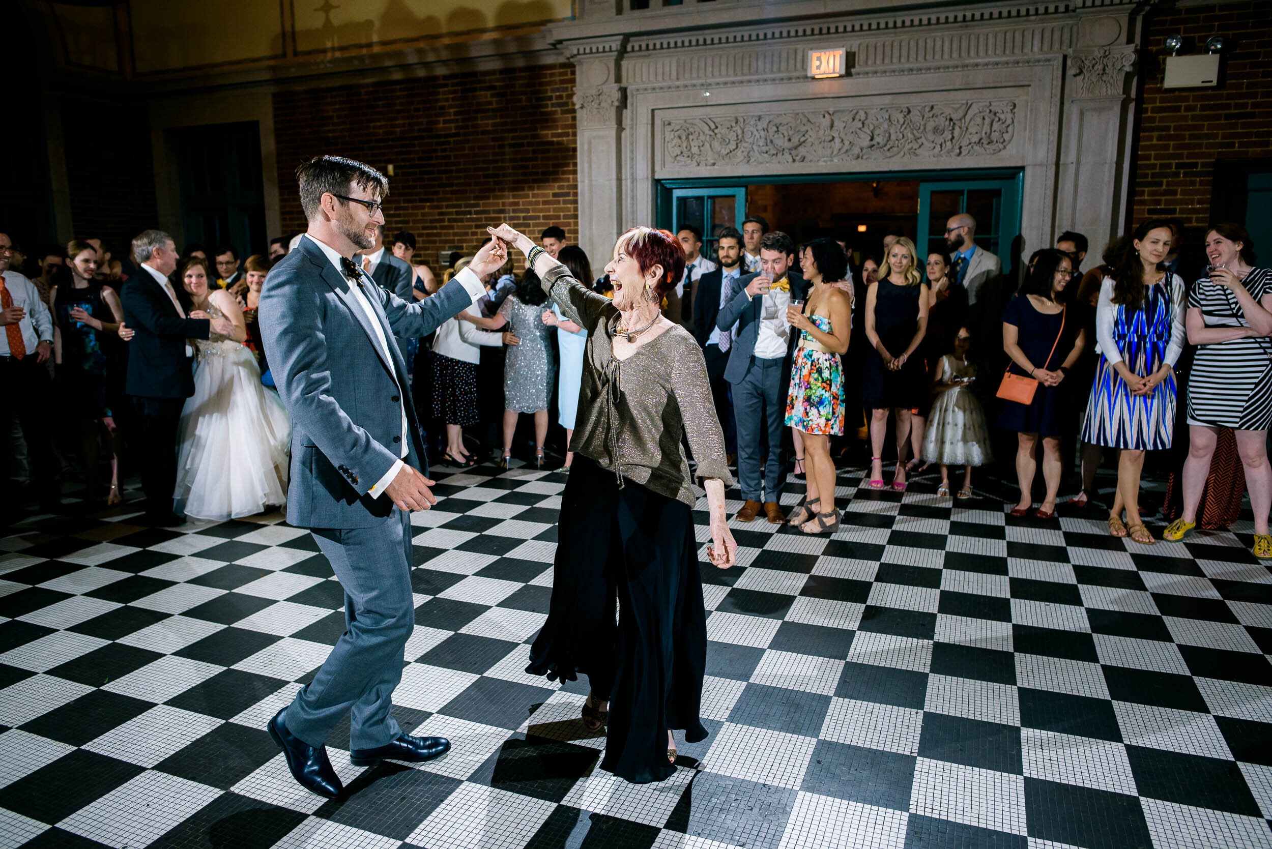 Mother son dance during the reception: Columbus Park Refectory Chicago wedding captured by J. Brown Photography.