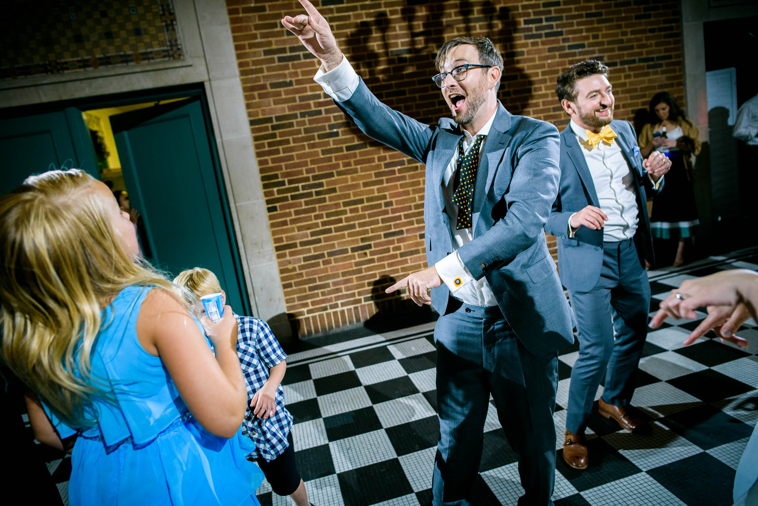 Groom on the dance floor during his reception: Columbus Park Refectory Chicago wedding captured by J. Brown Photography.