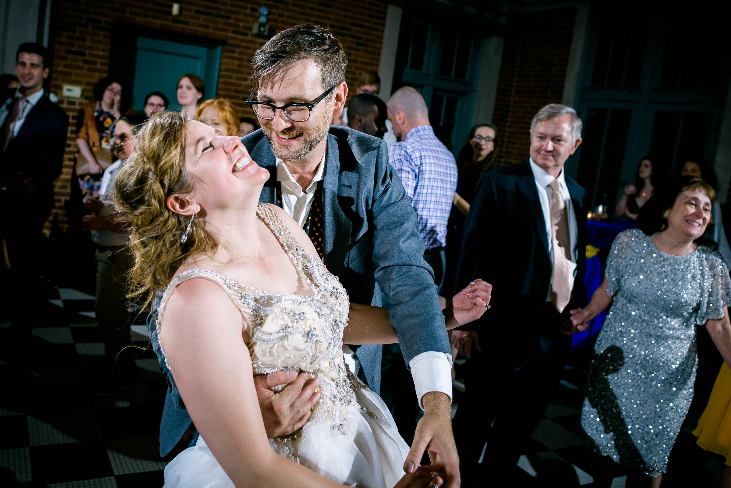 Bride and groom on the dance floor during the reception: Columbus Park Refectory Chicago wedding captured by J. Brown Photography.