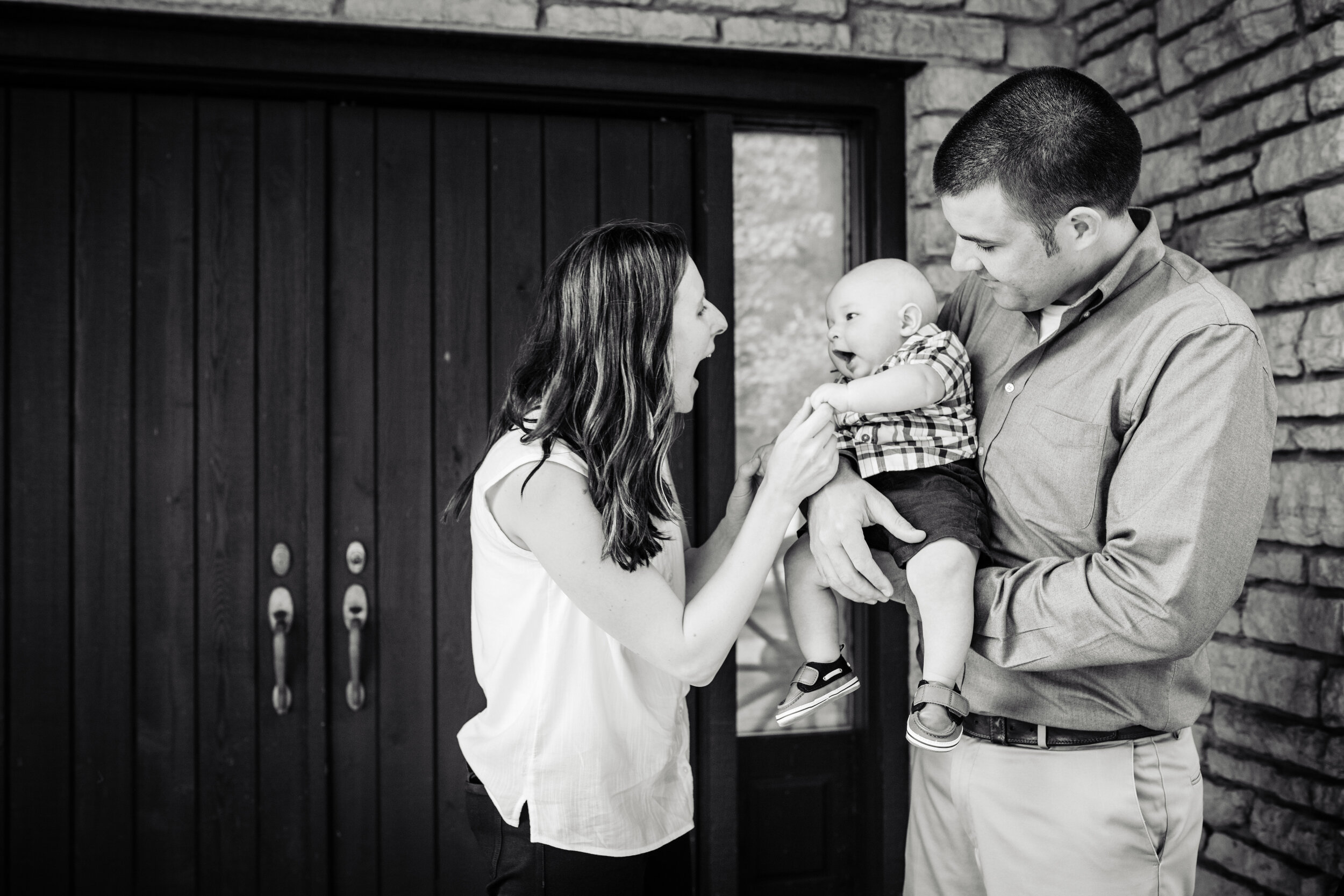 Fun photo of family with new baby:  family portrait session photographed by J. Brown Photography.