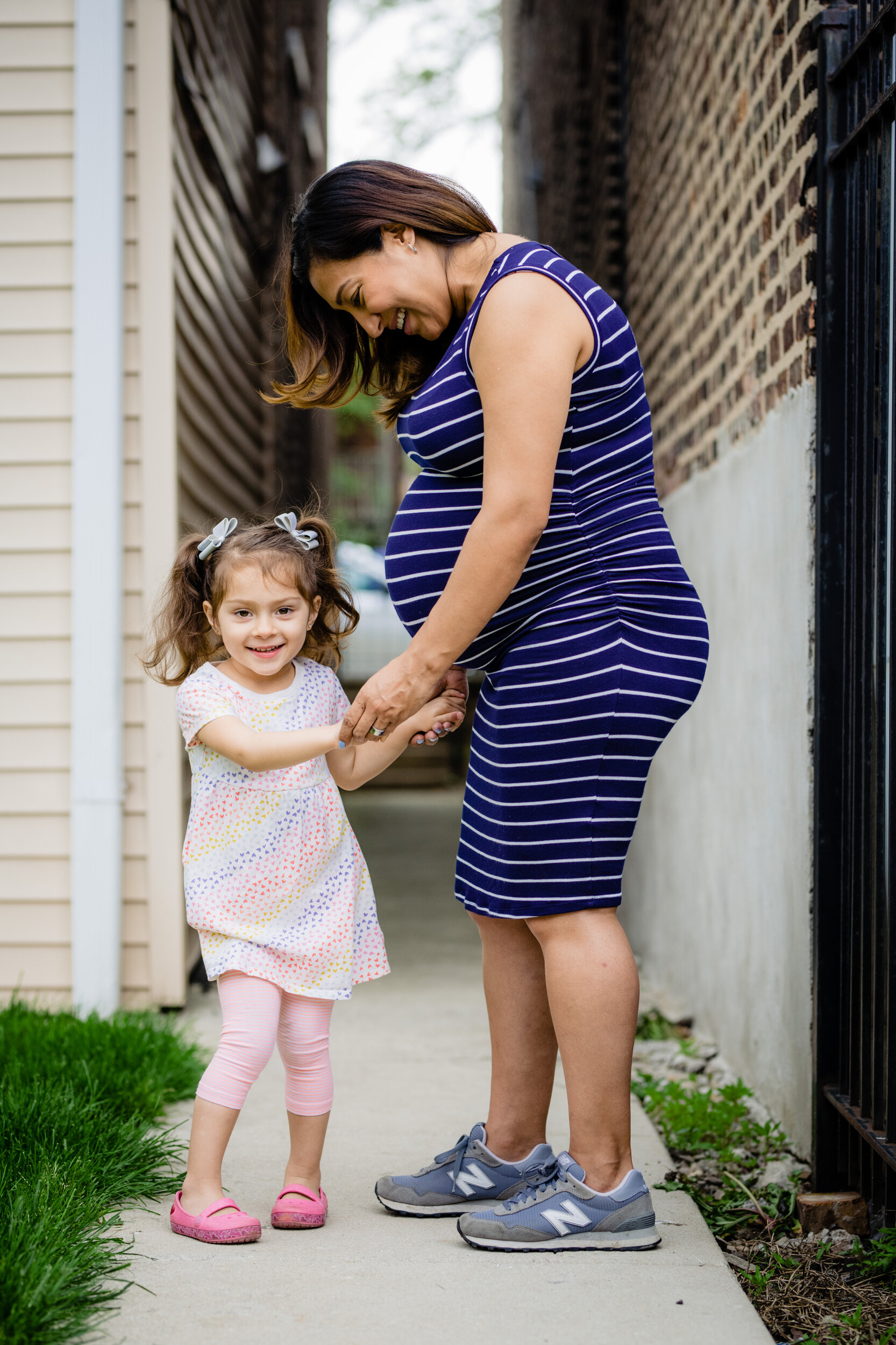 Mother and daughter maternity photo session: family portrait session photographed by J. Brown Photography.
