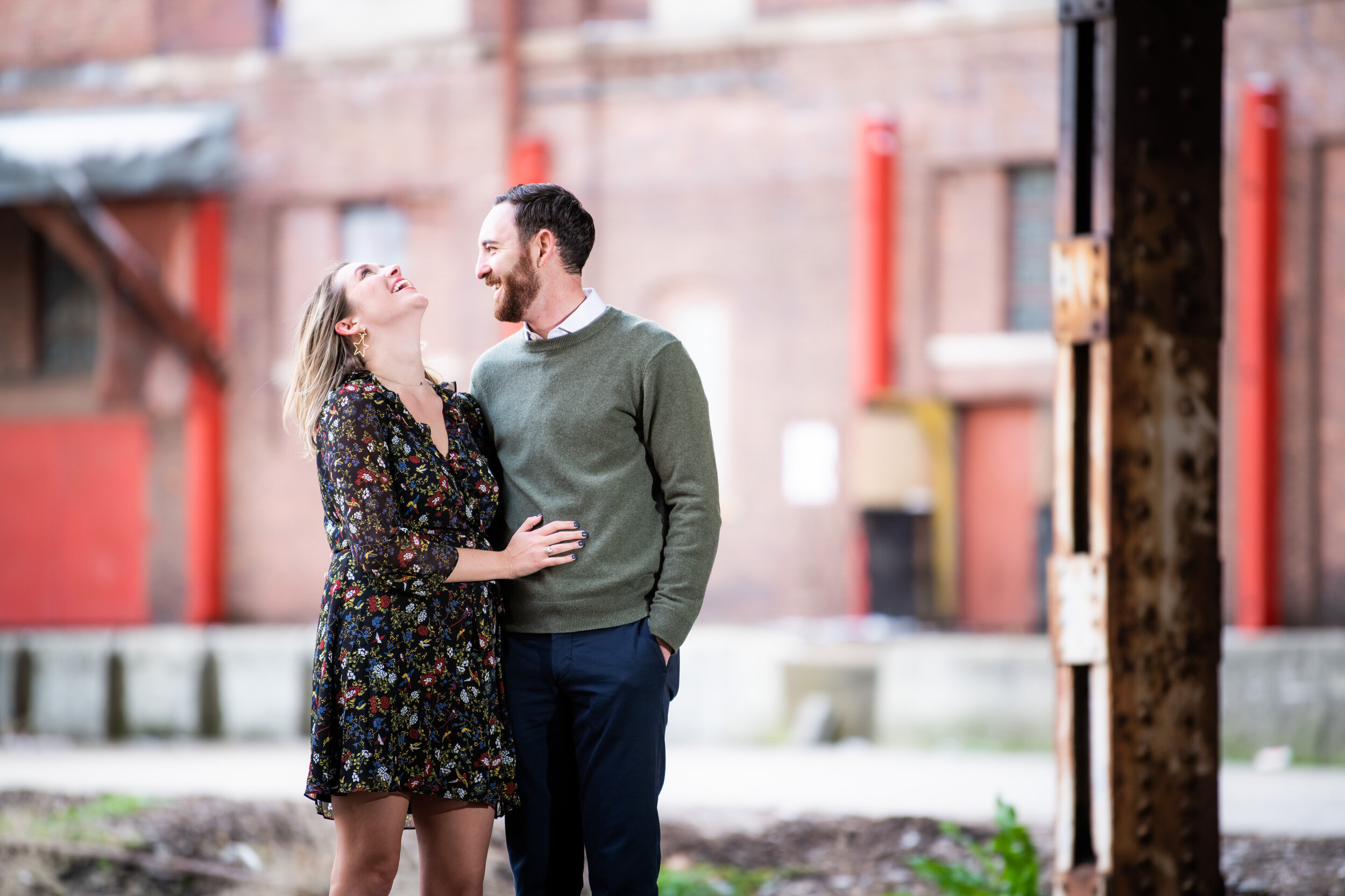 Bride and groom laugh during their Chicago engagement session:  engagement photo captured by J. Brown Photography.