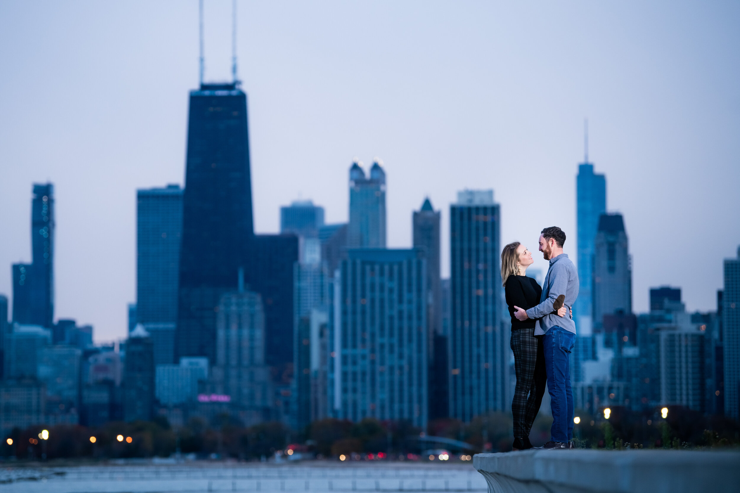 Chicago engagement session with the skyline at dusk: engagement photo captured by J. Brown Photography.