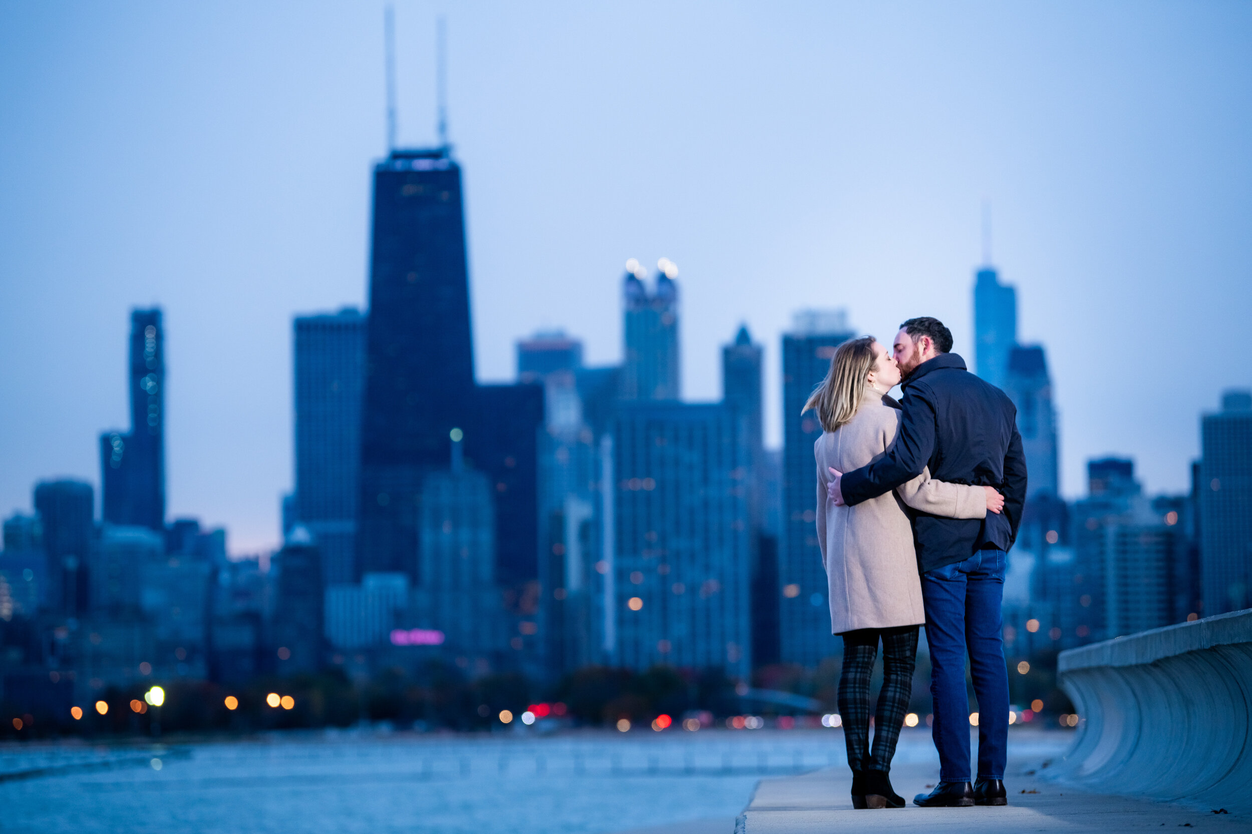 Chicago engagement session with the skyline at dusk: engagement photo captured by J. Brown Photography.