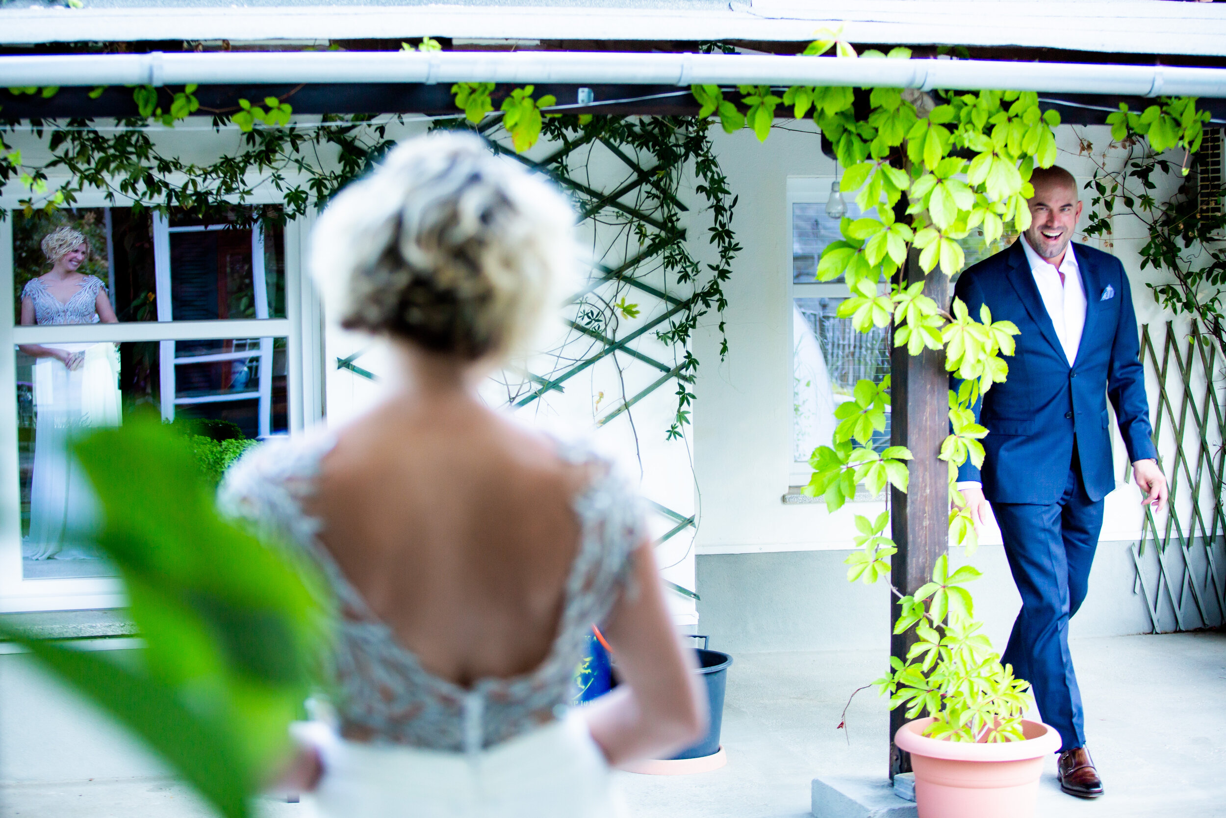 Groom reacts during the first look:  destination wedding photo at the Lost Unicorn Hotel, Tsagarada, Greece by J. Brown Photography.
