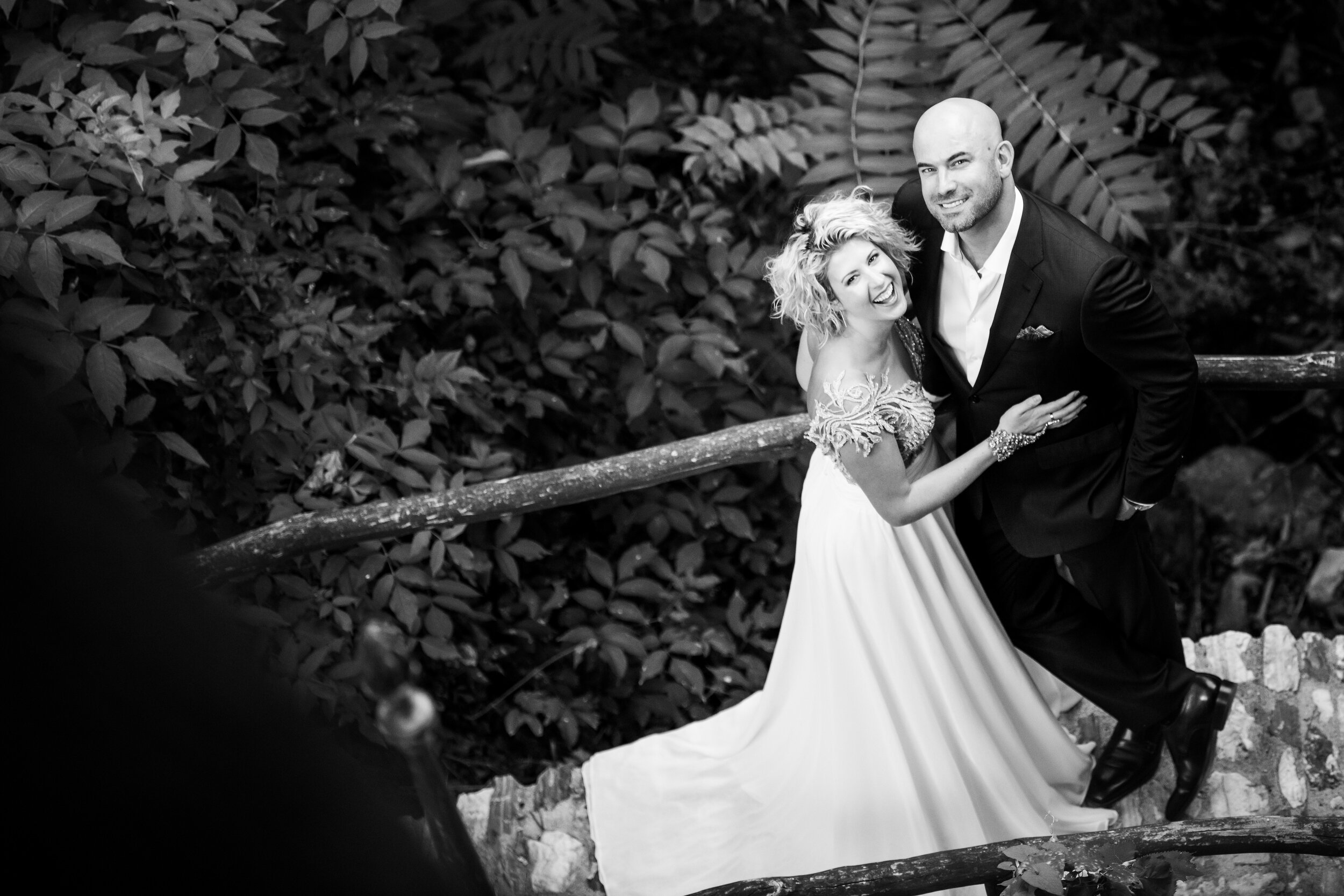 Bride and groom laugh during their wedding day portraits:  destination wedding photo at the Lost Unicorn Hotel, Tsagarada, Greece by J. Brown Photography.