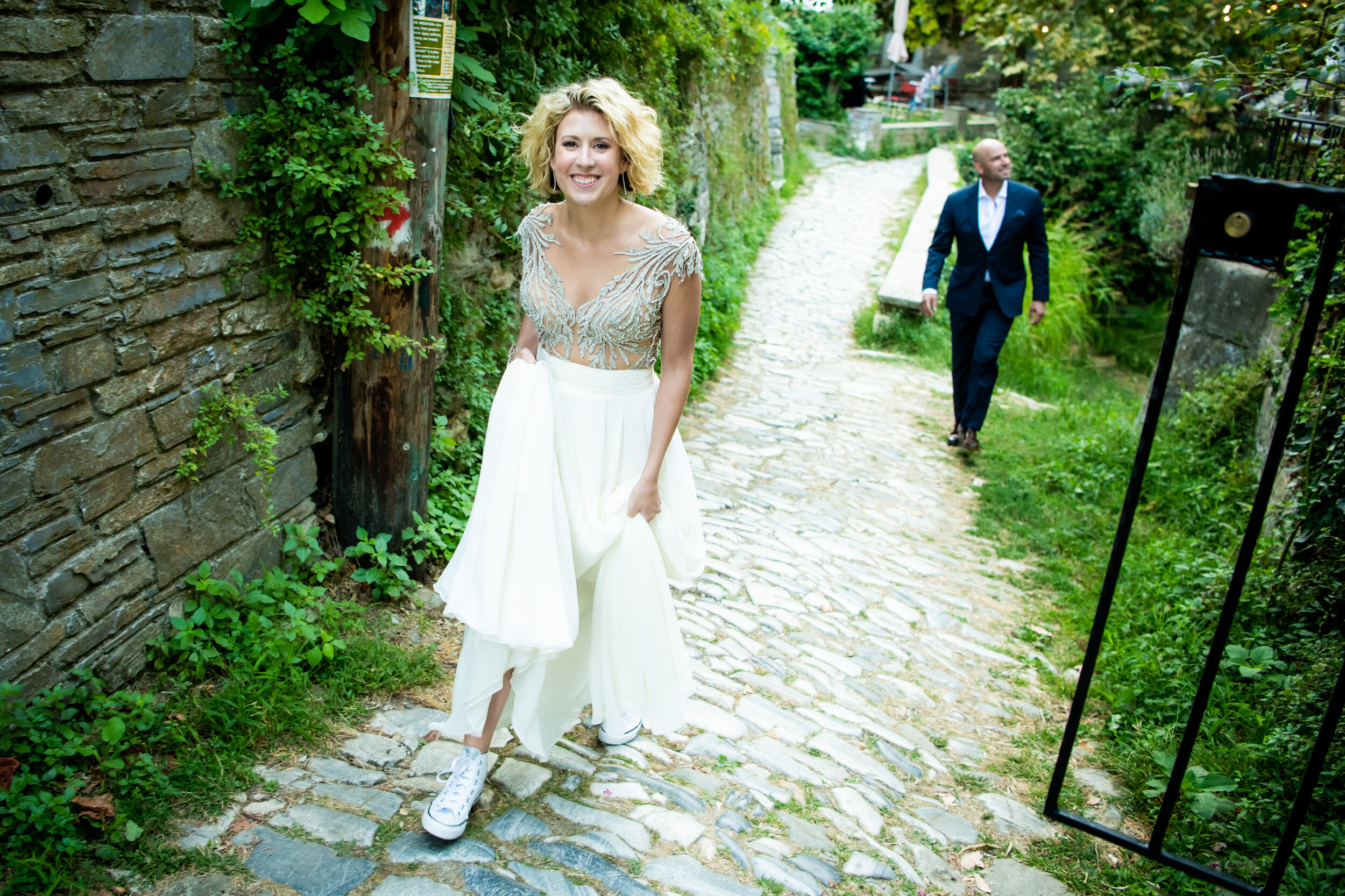 Bride and groom head to the reception on their wedding day: destination wedding photo at the Lost Unicorn Hotel, Tsagarada, Greece by J. Brown Photography.