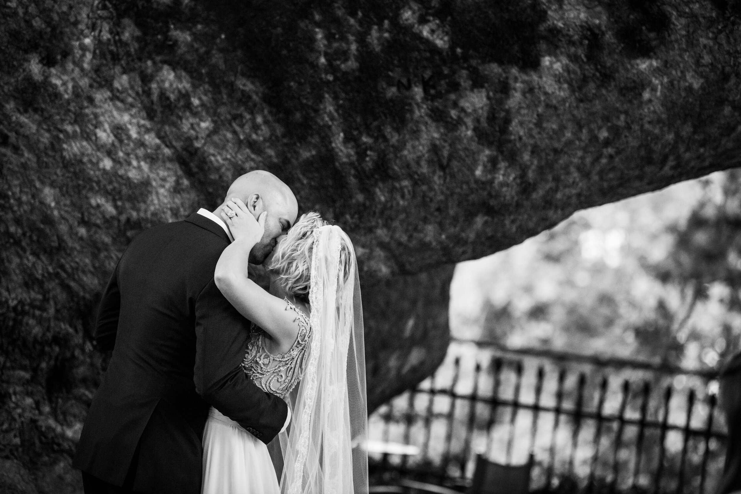 Bride and groom first kiss:  destination wedding photo at the Lost Unicorn Hotel, Tsagarada, Greece by J. Brown Photography.