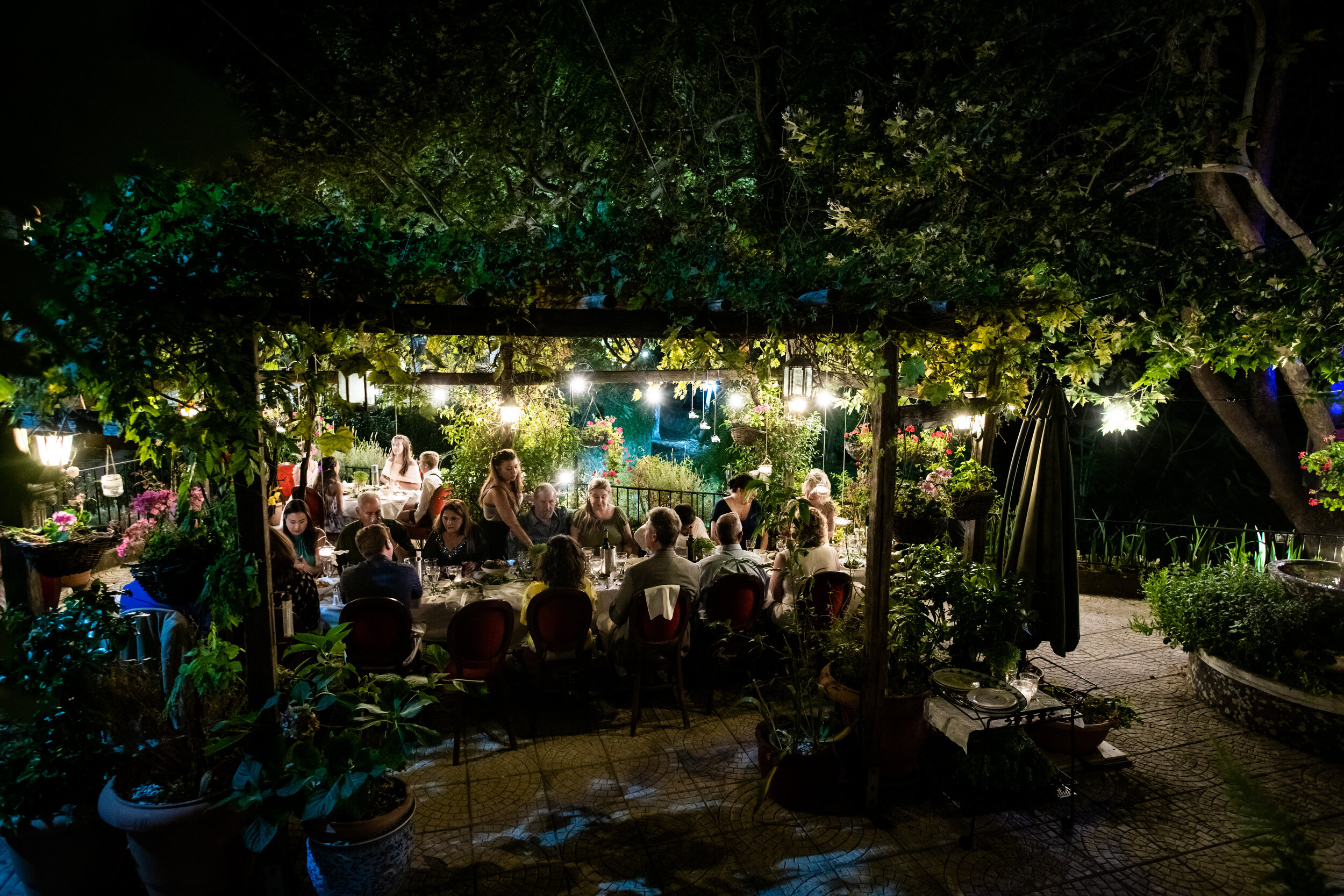 Outdoor wedding reception:  destination wedding photo at the Lost Unicorn Hotel, Tsagarada, Greece by J. Brown Photography.