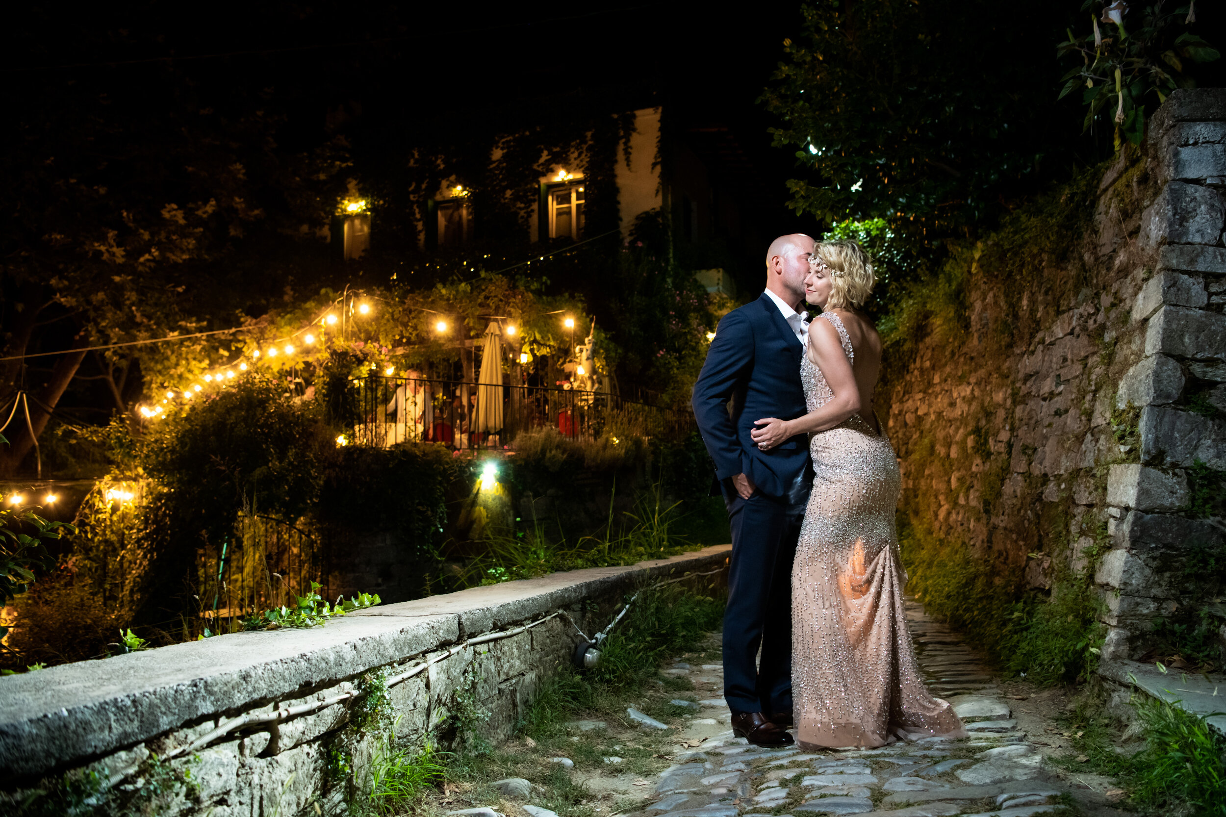 Night portrait of the bride and groom:  destination wedding photo at the Lost Unicorn Hotel, Tsagarada, Greece by J. Brown Photography.