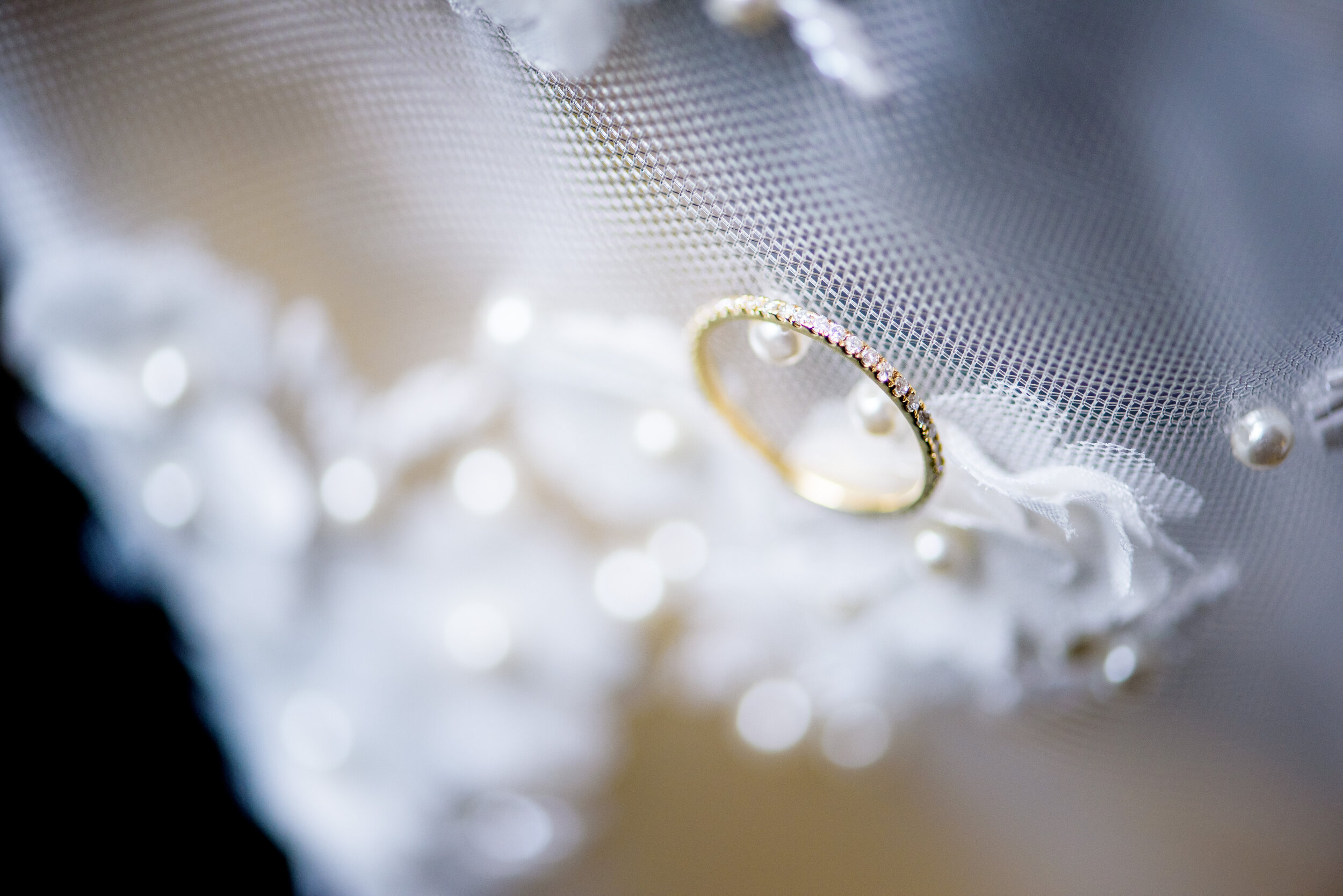 Creative wedding ring detail photo: Geraghty Chicago wedding photography captured by J. Brown Photography.