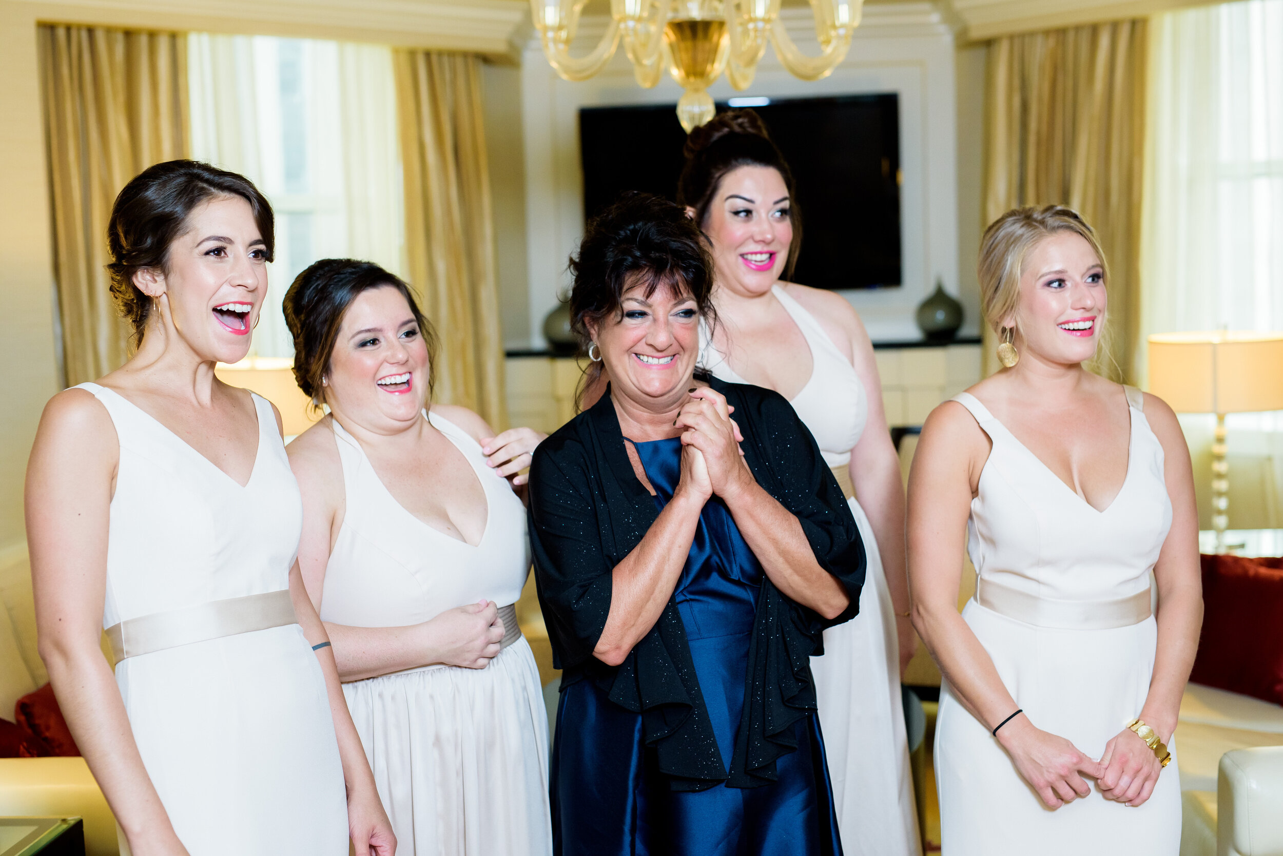 Bridesmaids first look of the bride at the JW Marriott: Geraghty Chicago wedding photography captured by J. Brown Photography.