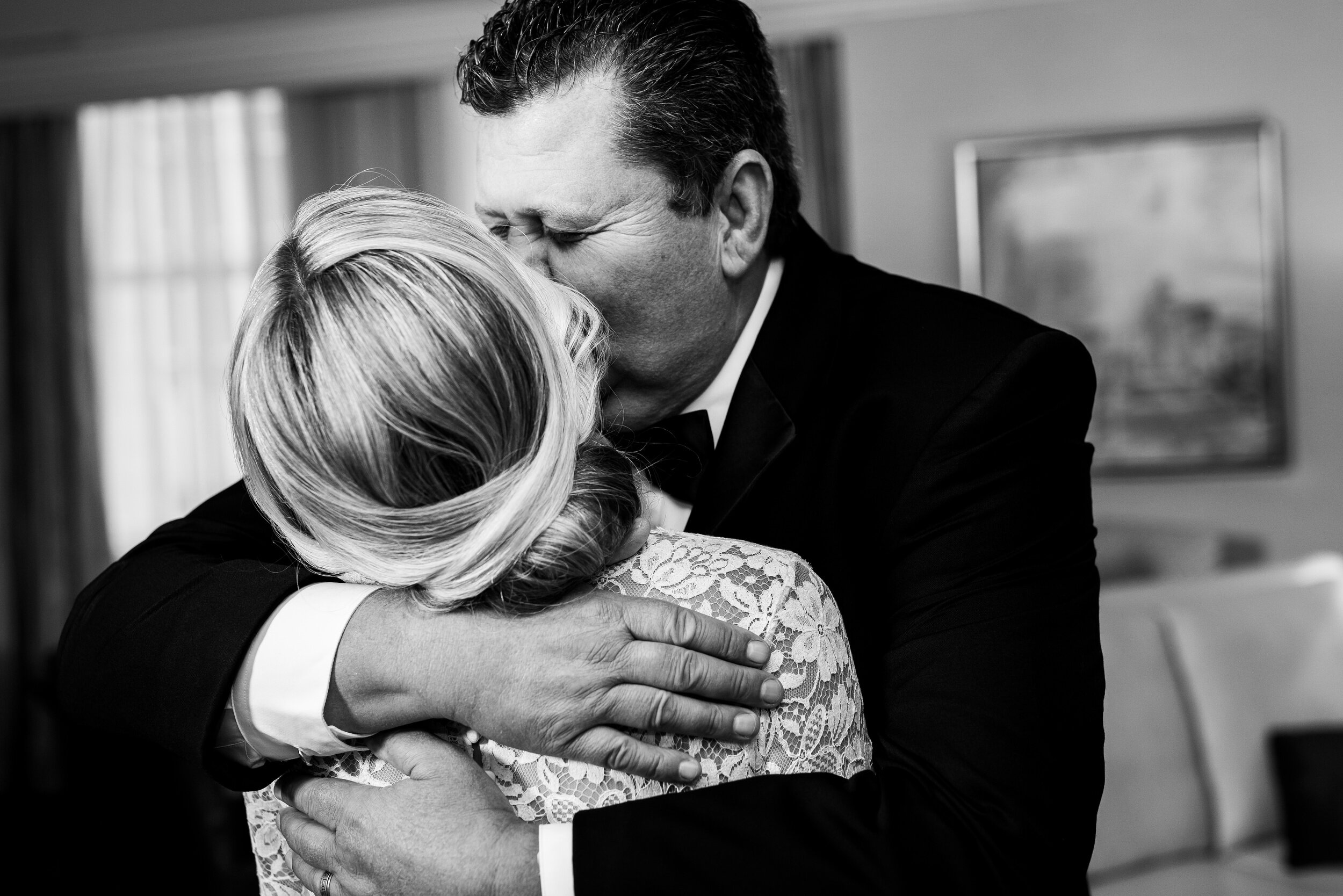 Bride and father hug while getting ready: Geraghty Chicago wedding photography captured by J. Brown Photography.