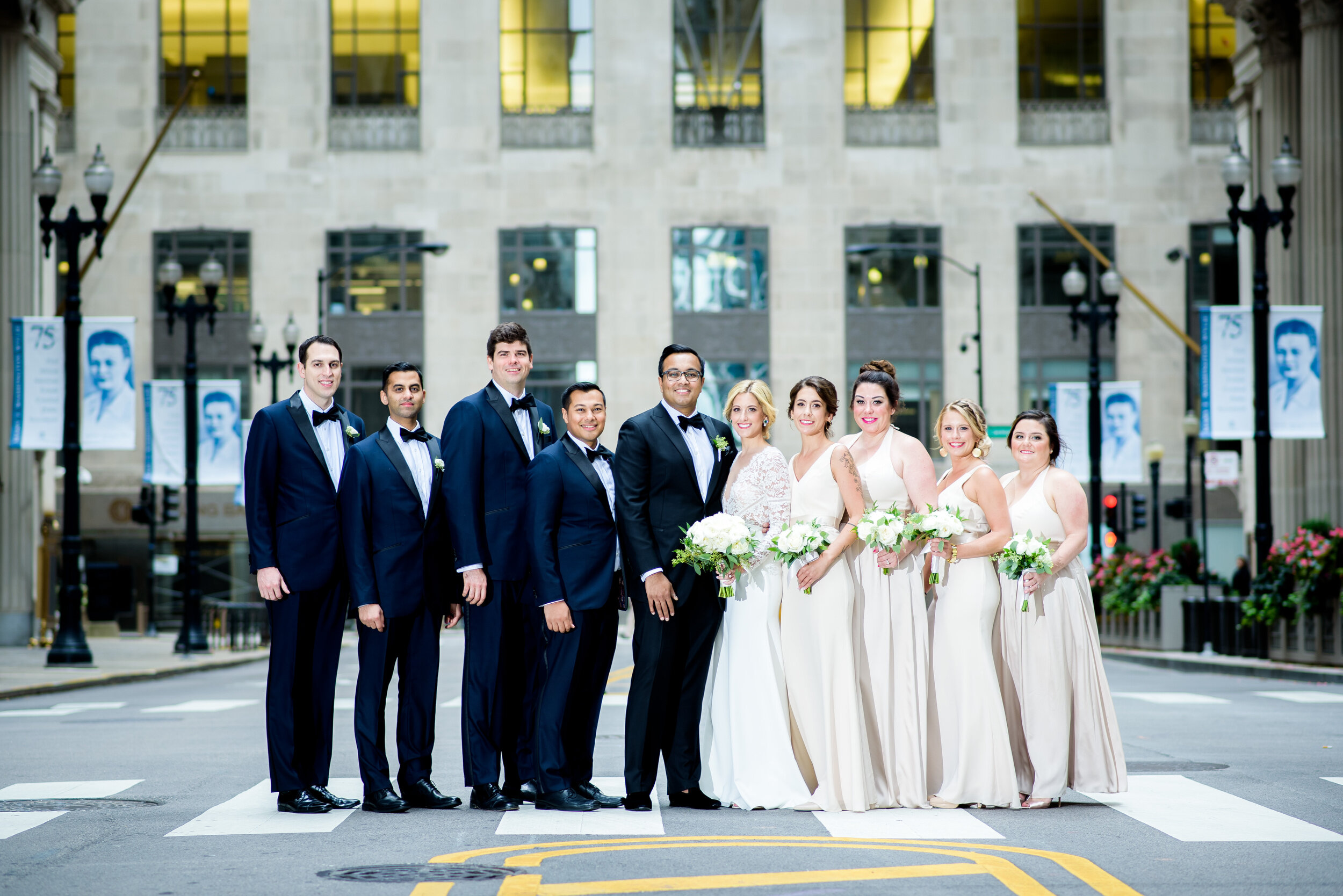 Wedding party portrait outside the Board of Trade: Geraghty Chicago wedding photography captured by J. Brown Photography.