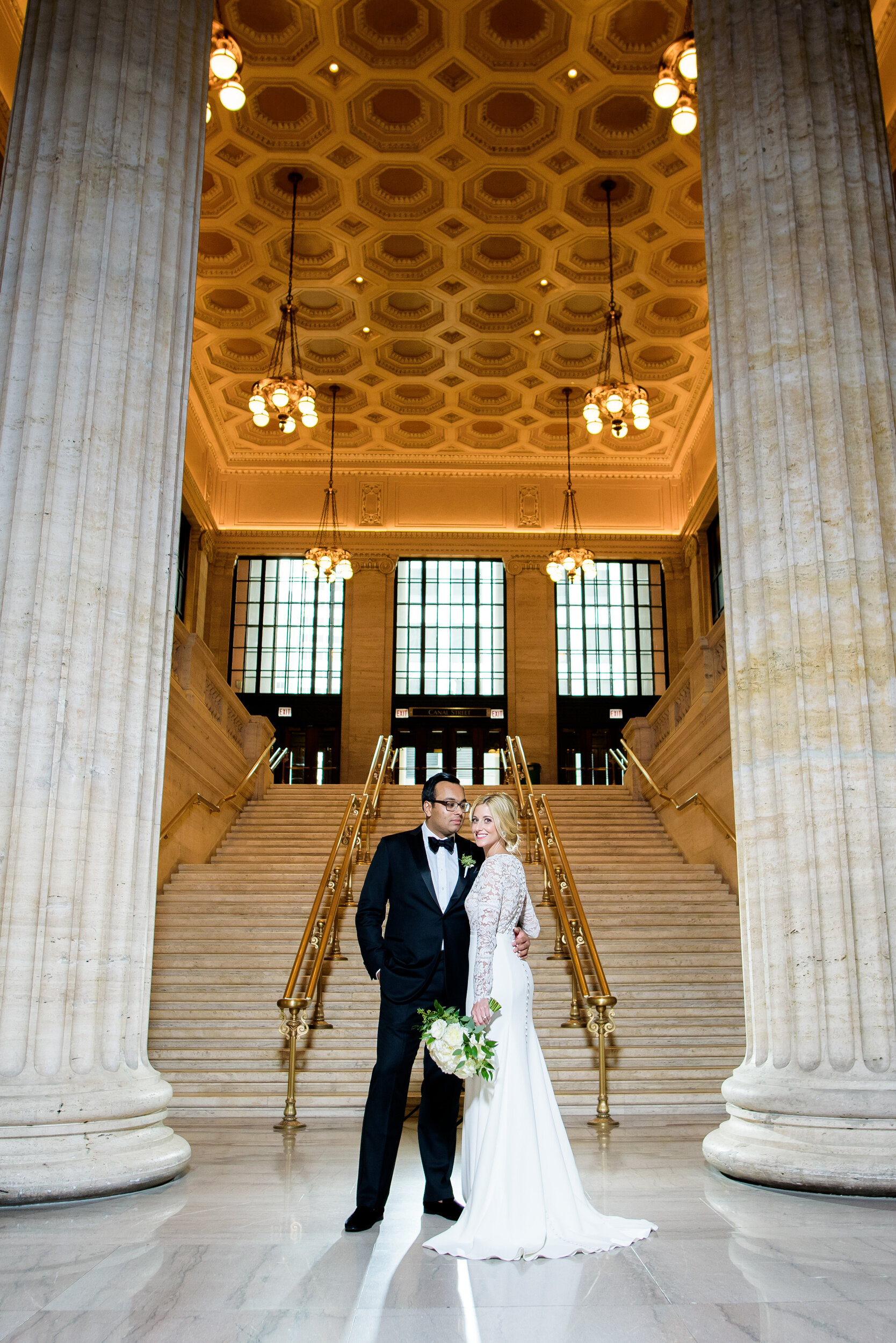 Bride and groom portrait at Chicago Union Station: Geraghty Chicago wedding photography captured by J. Brown Photography.