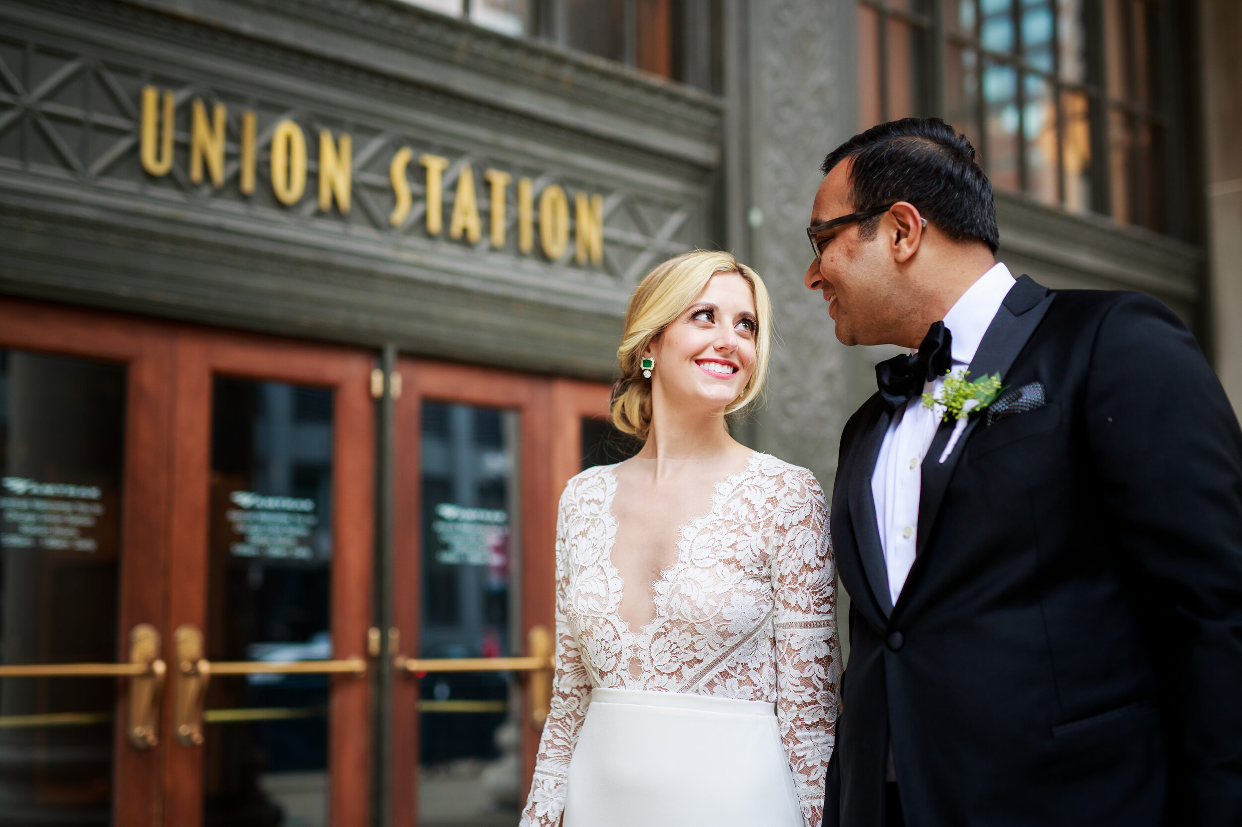 Wedding photo outside Chicago Union Station: Geraghty Chicago wedding photography captured by J. Brown Photography.