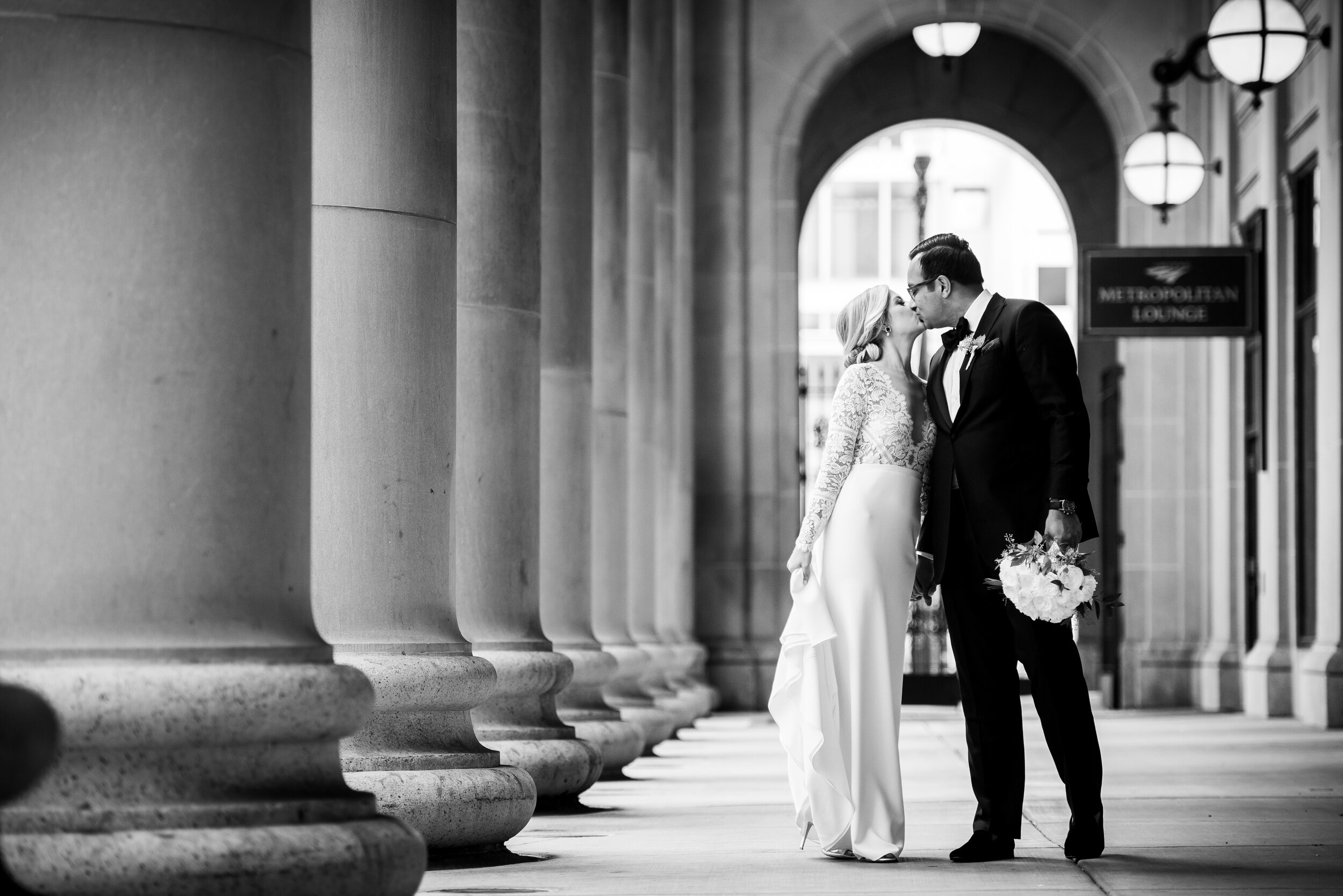 Creative wedding portrait outside Chicago Union Station:Geraghty Chicago wedding photography captured by J. Brown Photography.