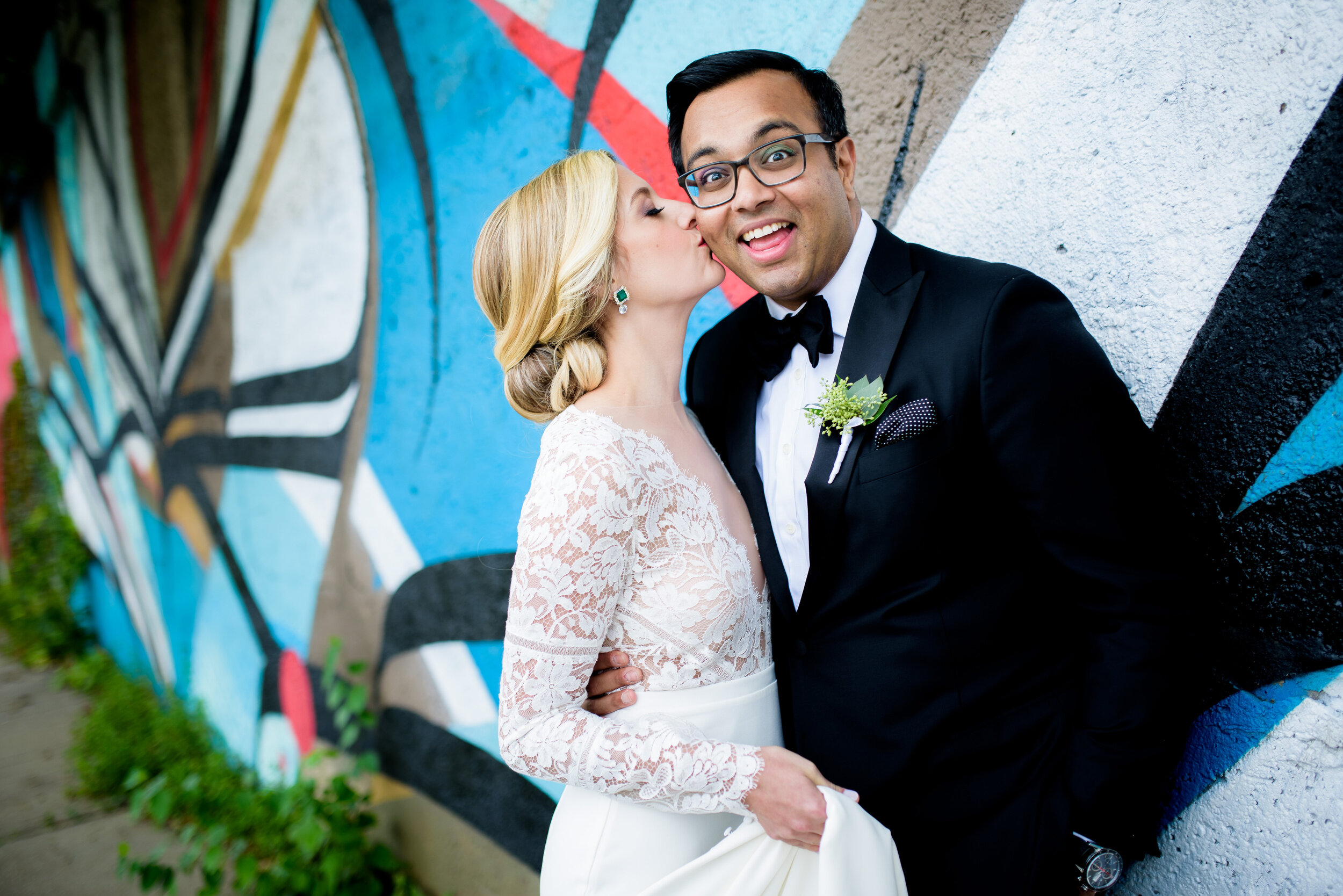 Fun photo of bride and groom on wedding day: Geraghty Chicago wedding photography captured by J. Brown Photography.