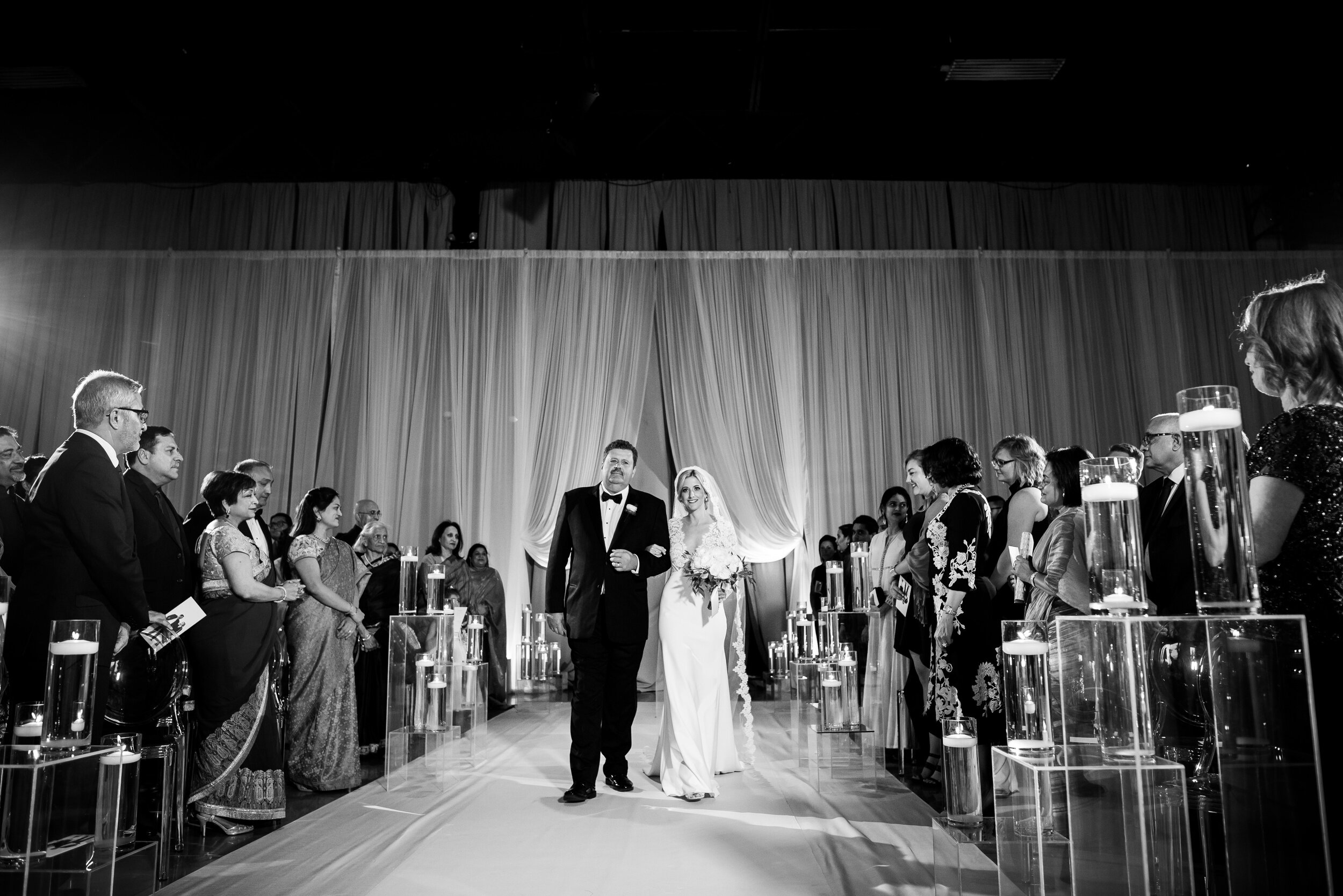Bride and father walk down the aisle: Geraghty Chicago wedding photography captured by J. Brown Photography.