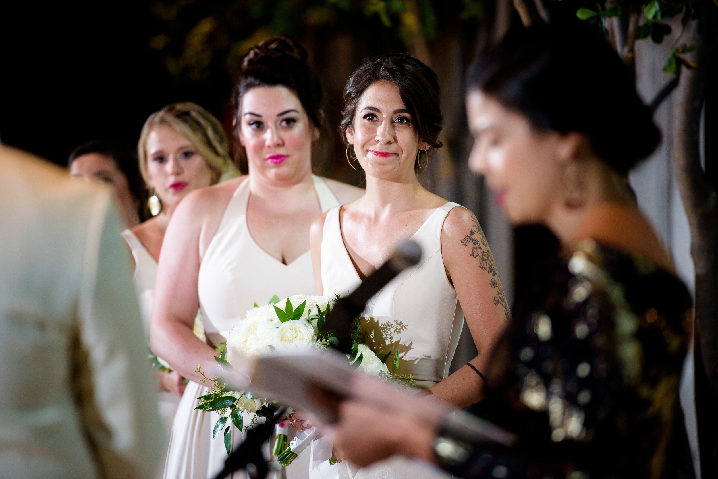 Sister of the bride emotional during the ceremony: Geraghty Chicago wedding photography captured by J. Brown Photography.