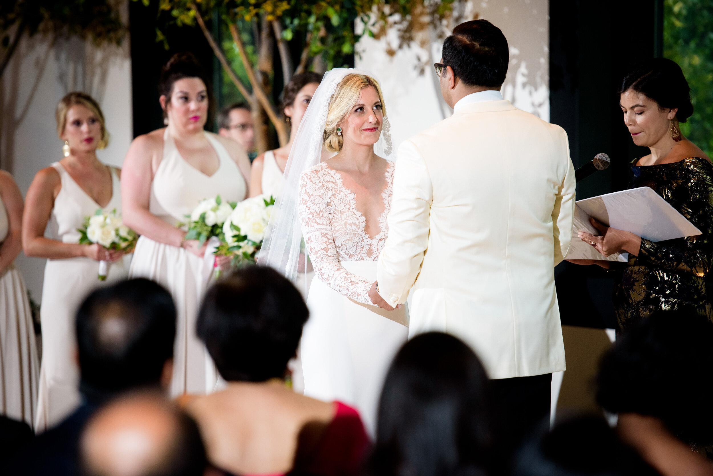 Bride and groom say their vows during the wedding ceremony: Geraghty Chicago wedding photography captured by J. Brown Photography.