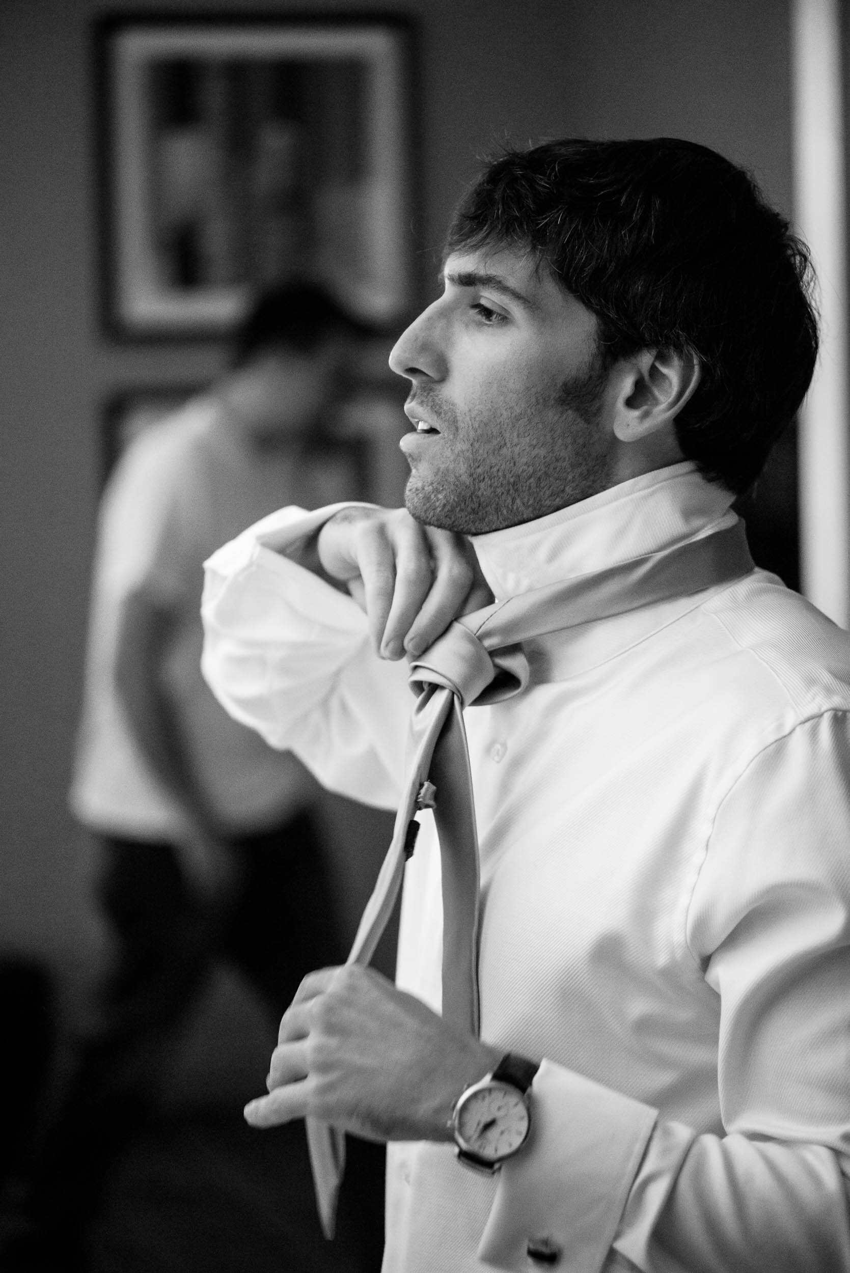 Groom getting ready on the wedding day: Ravenswood Event Center Chicago wedding captured by J. Brown Photography.  