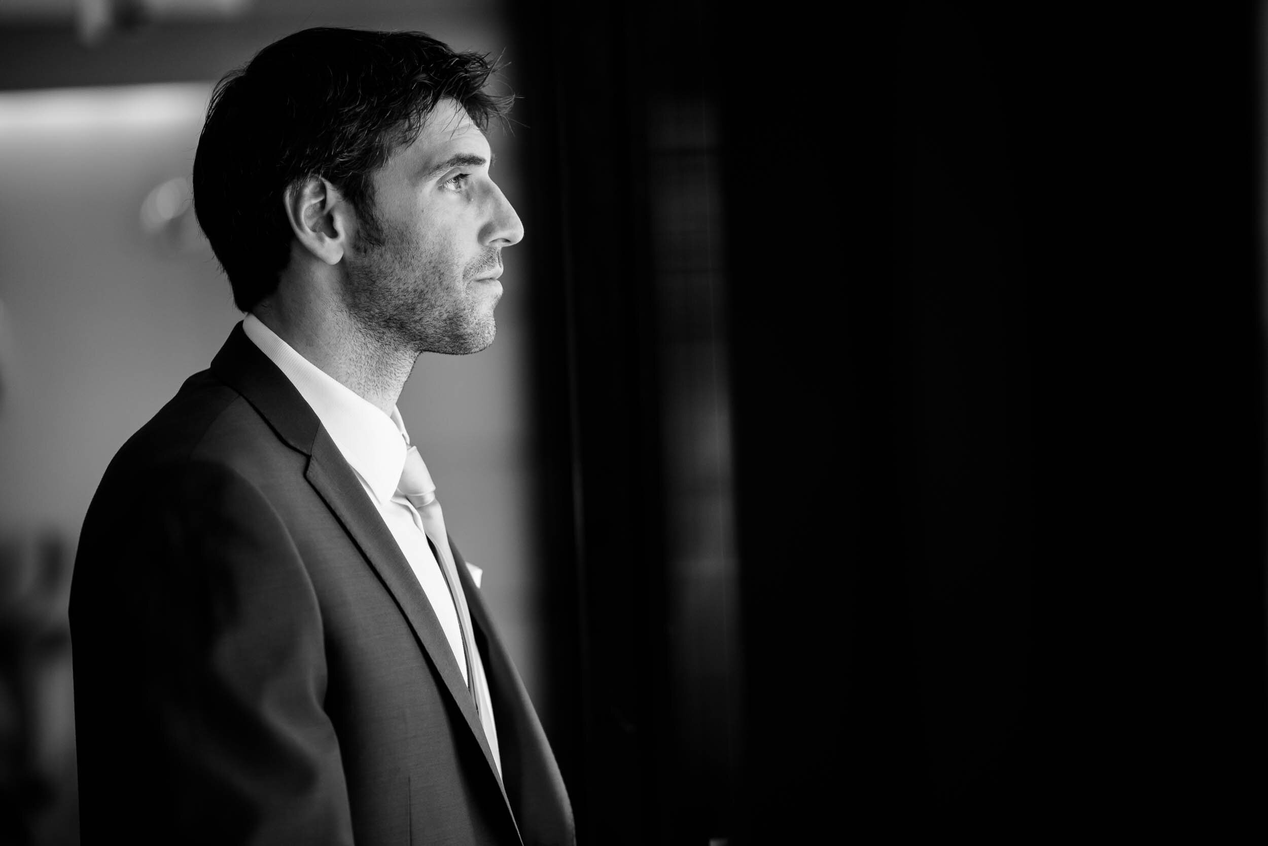 Groom waiting for the first look: Ravenswood Event Center Chicago wedding captured by J. Brown Photography.  