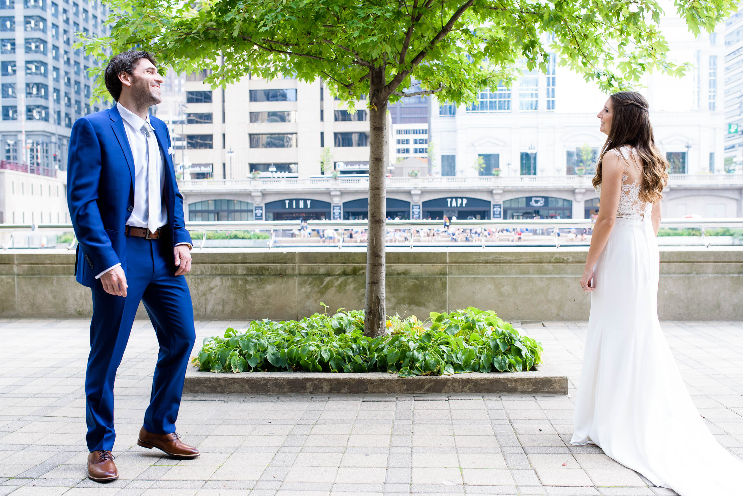 Bride and groom first look on the Chicago river: Ravenswood Event Center Chicago wedding captured by J. Brown Photography.  