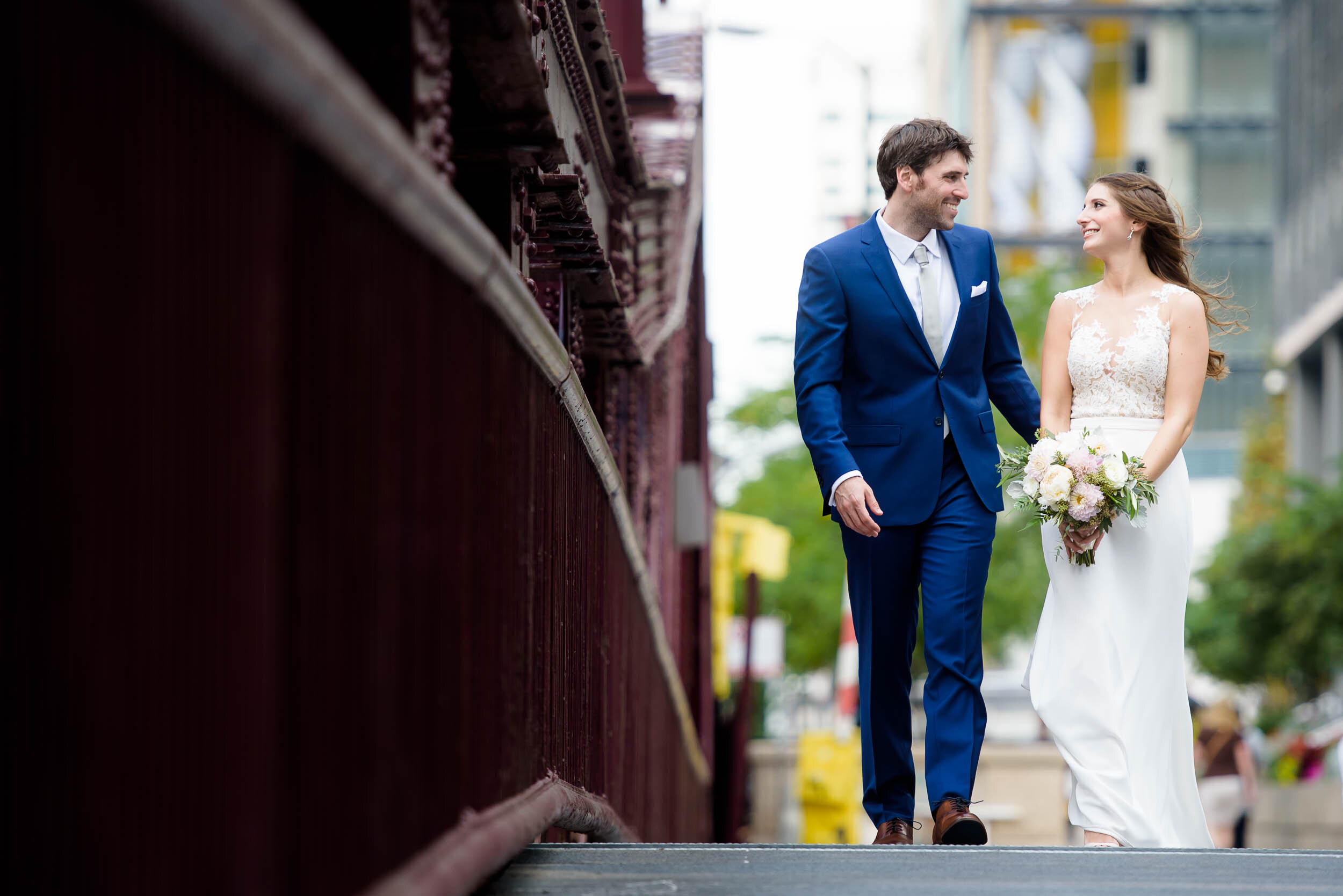 Bride and groom wedding photo over the Chicago River: Ravenswood Event Center Chicago wedding captured by J. Brown Photography.  