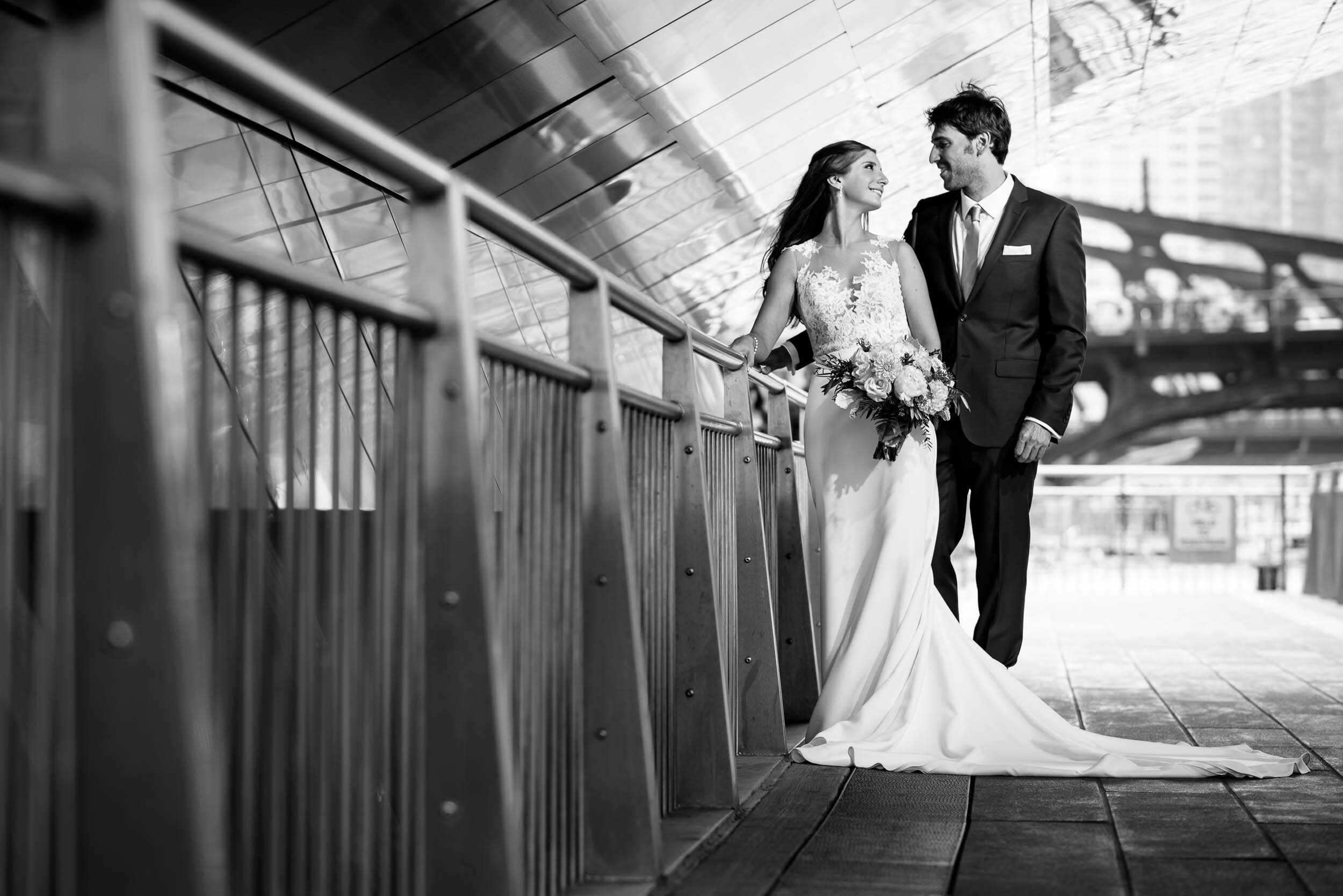 Creative black and white portrait of bride and groom on the Chicago River: Ravenswood Event Center Chicago wedding captured by J. Brown Photography.  