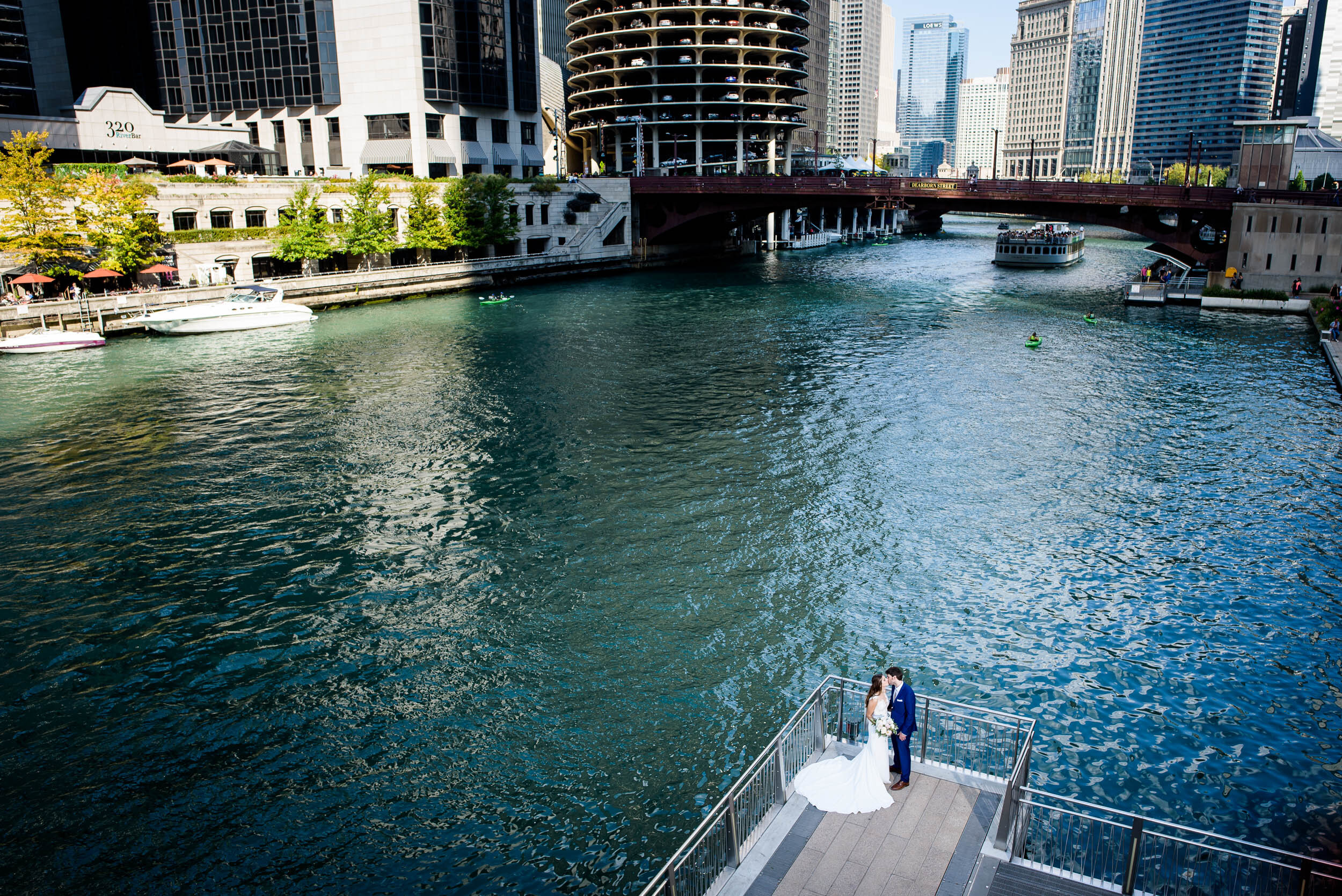 Creative portrait of bride and groom from above on the Chicago Riverwalk: Ravenswood Event Center Chicago wedding captured by J. Brown Photography.  