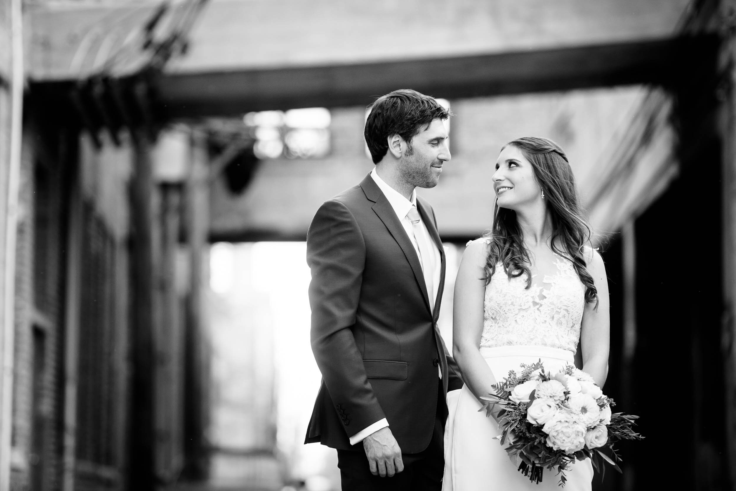 Urban portrait of bride and groom: Ravenswood Event Center Chicago wedding captured by J. Brown Photography.  