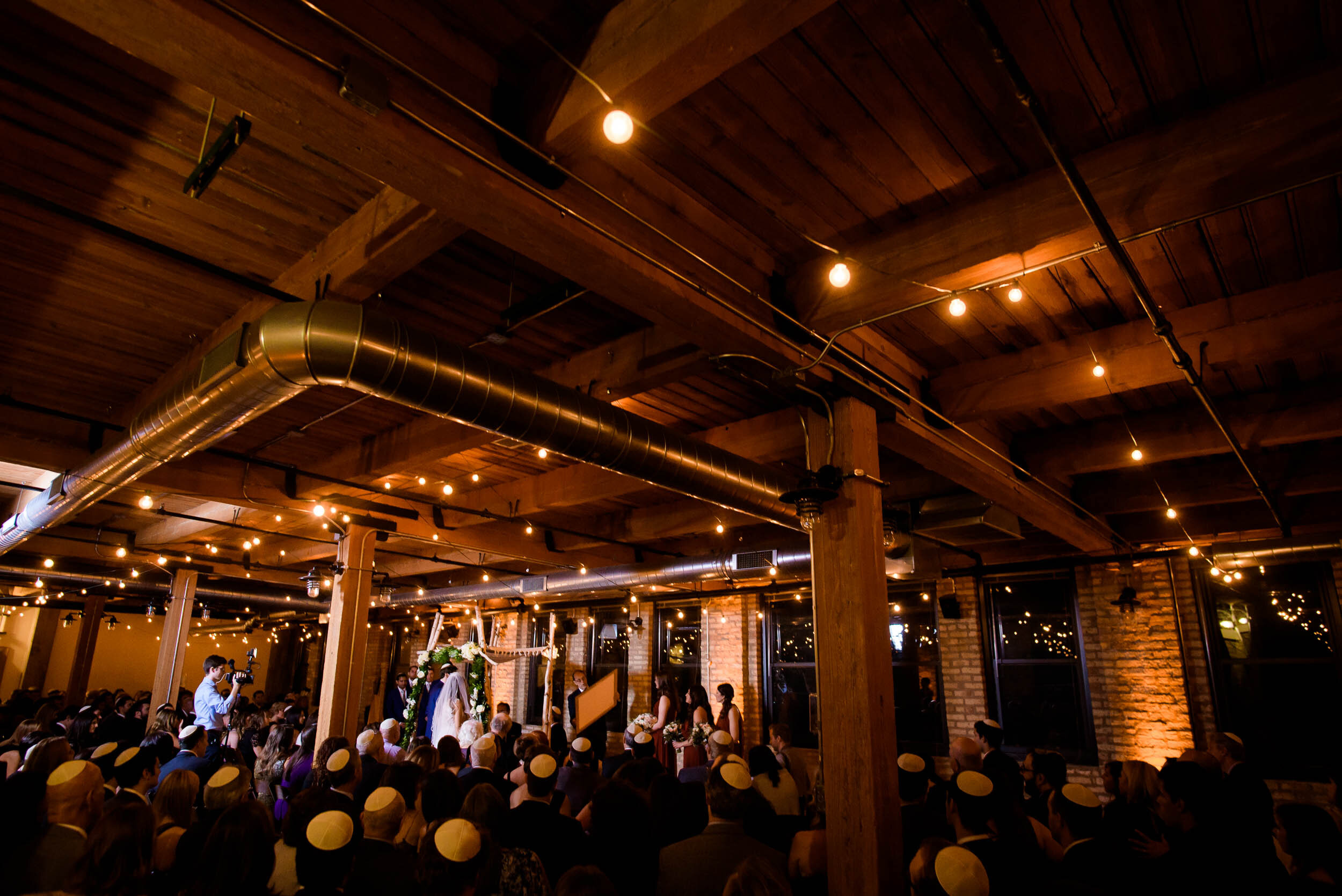 Jewish ceremony photo: Ravenswood Event Center Chicago wedding captured by J. Brown Photography.  