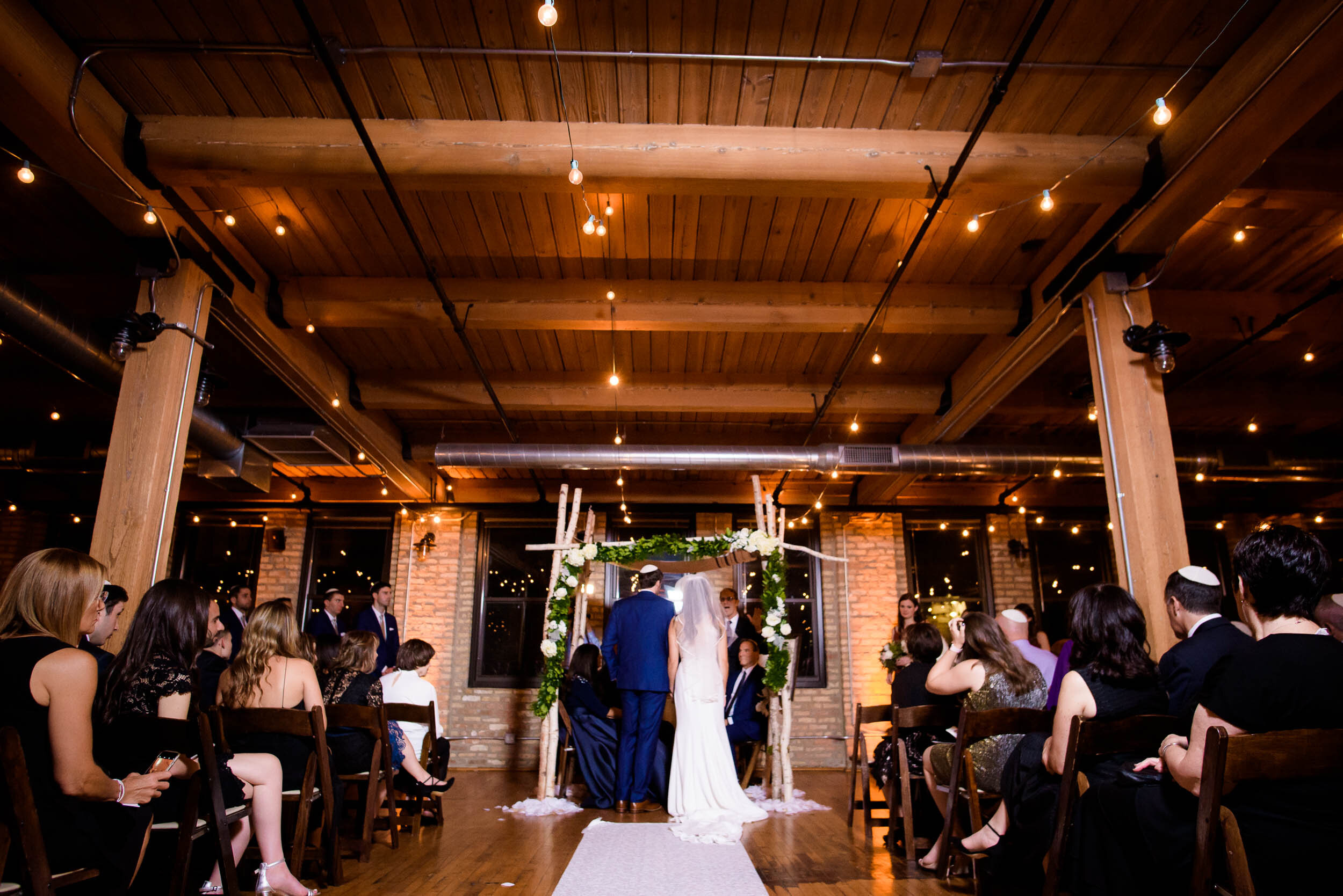 Jewish ceremony photo: Ravenswood Event Center Chicago wedding captured by J. Brown Photography.  
