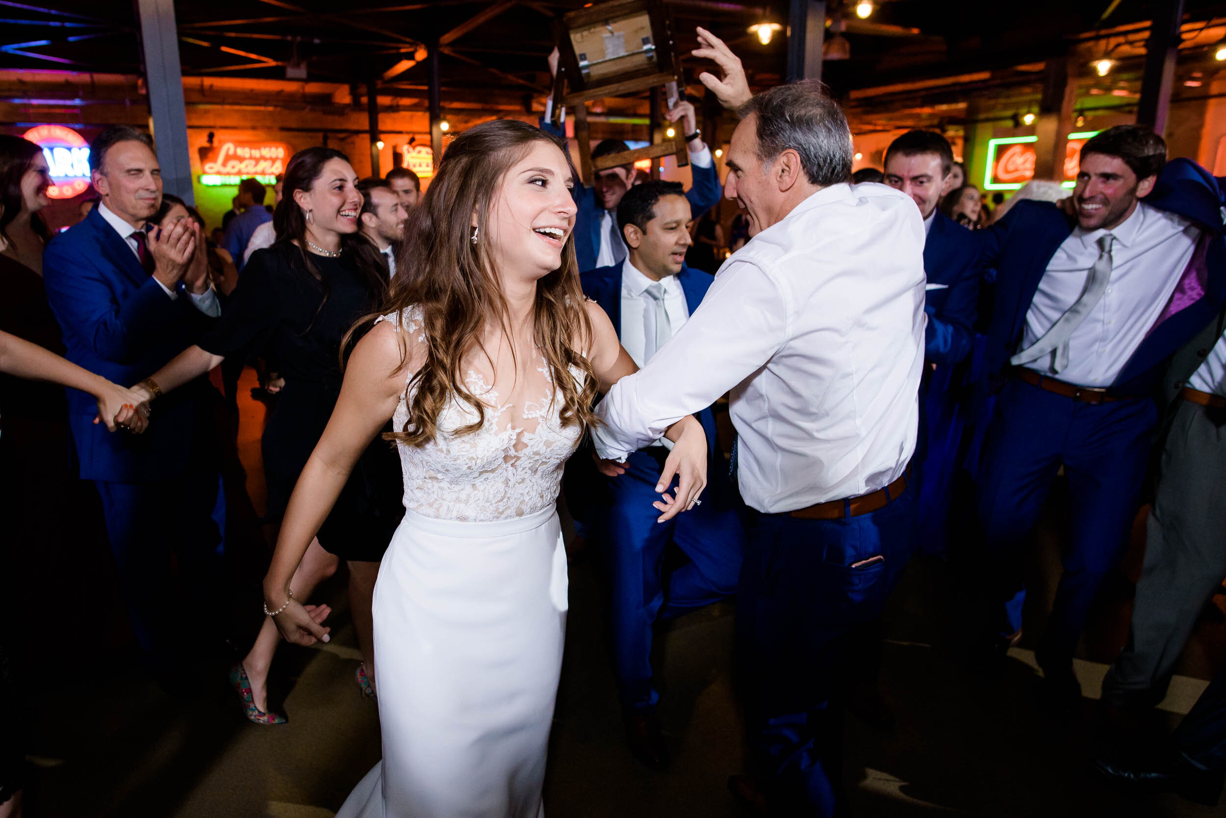 Bride dances during the horah: Ravenswood Event Center Chicago wedding captured by J. Brown Photography.  