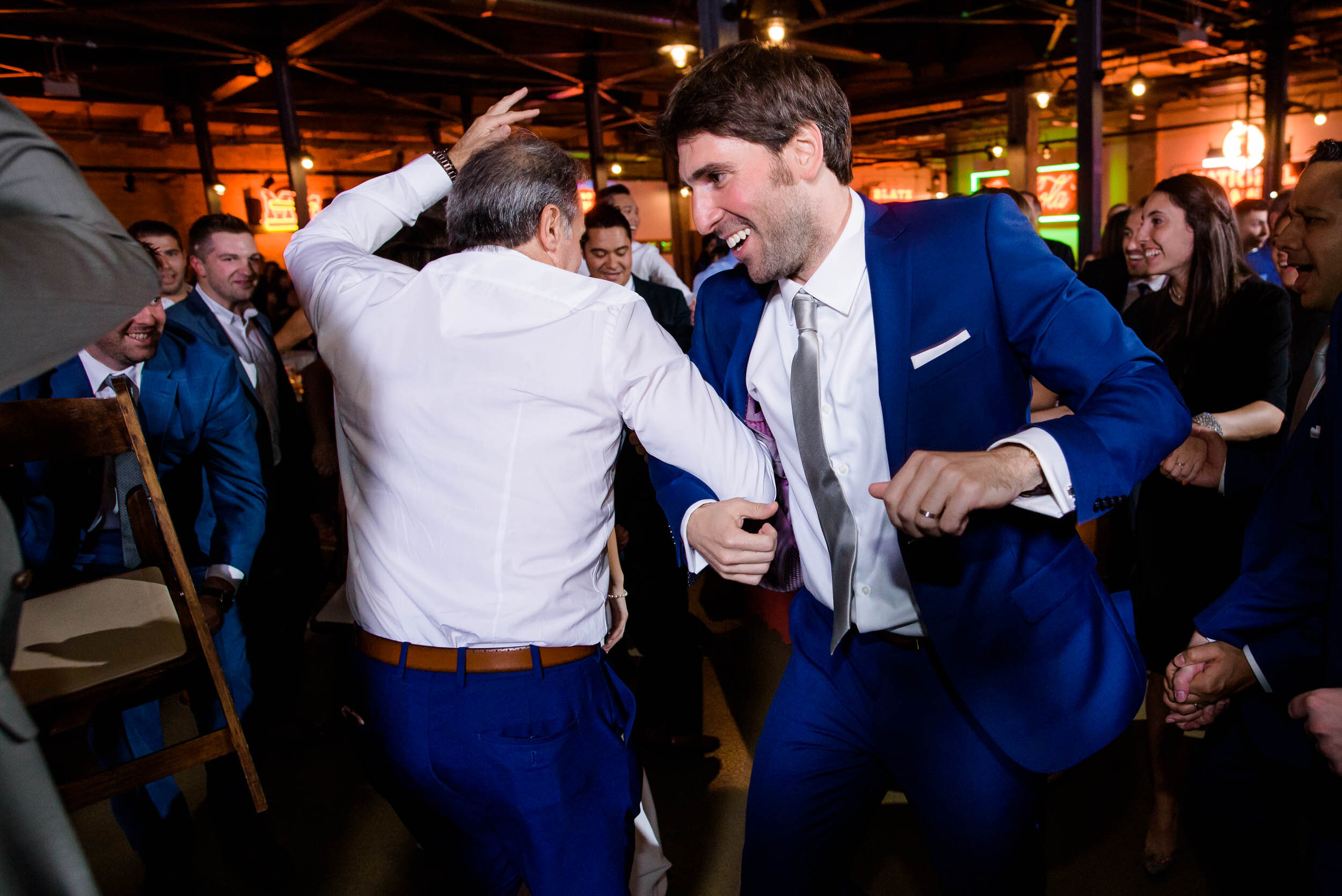 Groom dances during the horah: Ravenswood Event Center Chicago wedding captured by J. Brown Photography.  