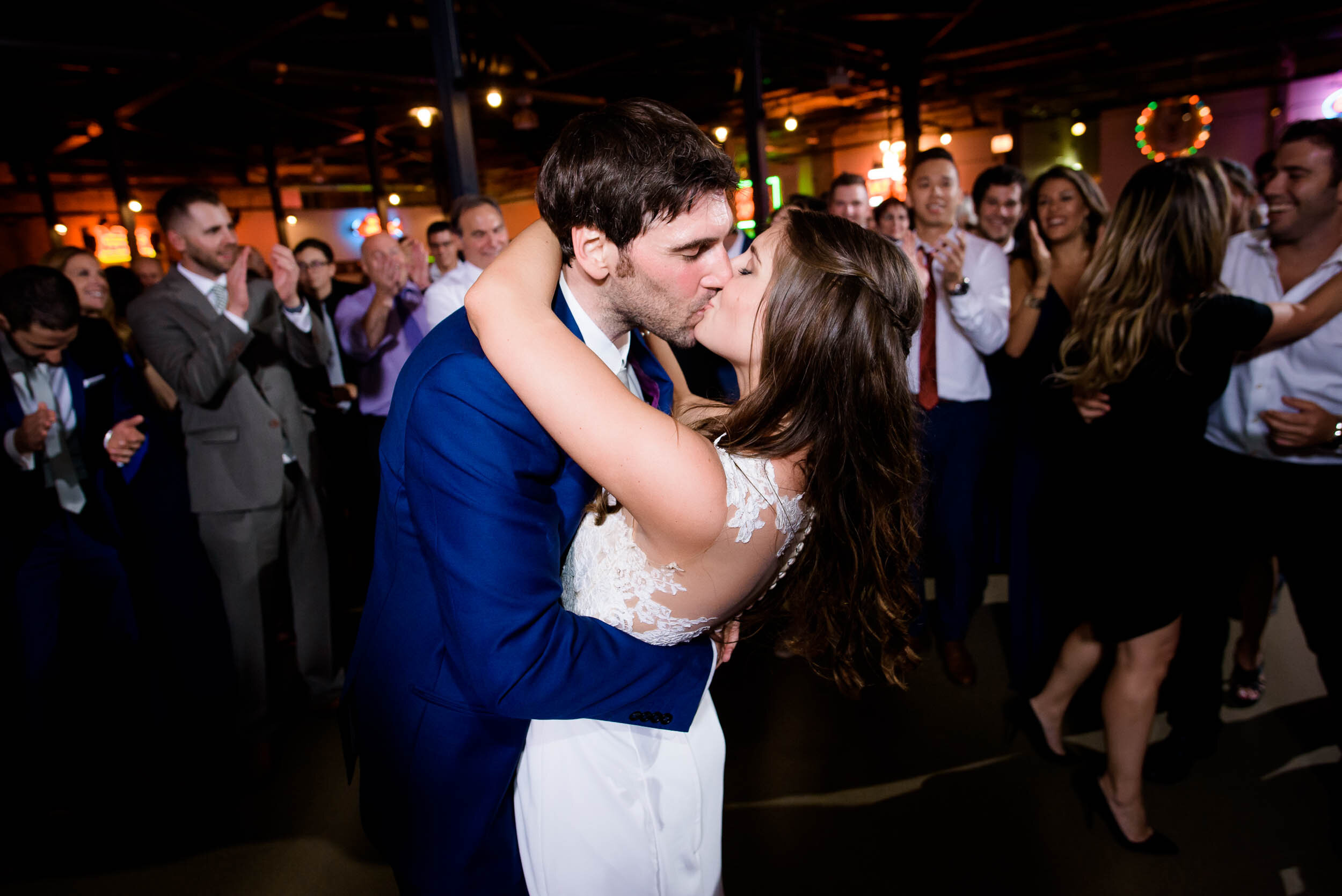 Bride and groom kiss on the dance floor: Ravenswood Event Center Chicago wedding captured by J. Brown Photography.  