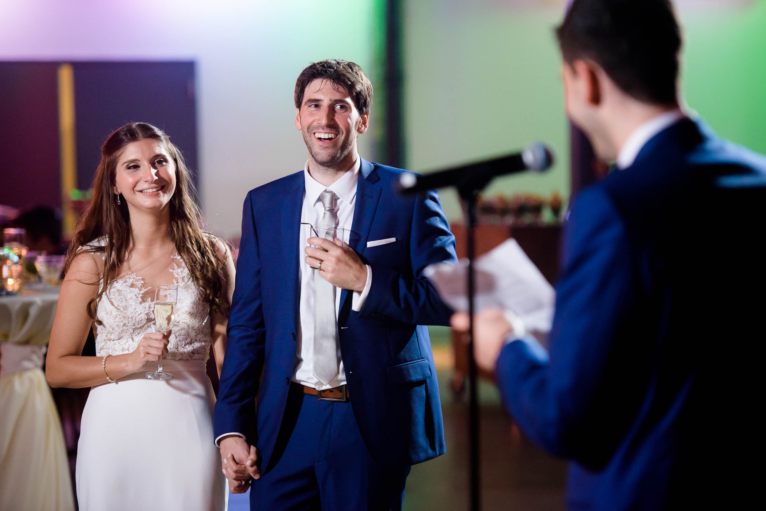 Couple laughs during the best man speech: Ravenswood Event Center Chicago wedding captured by J. Brown Photography.  