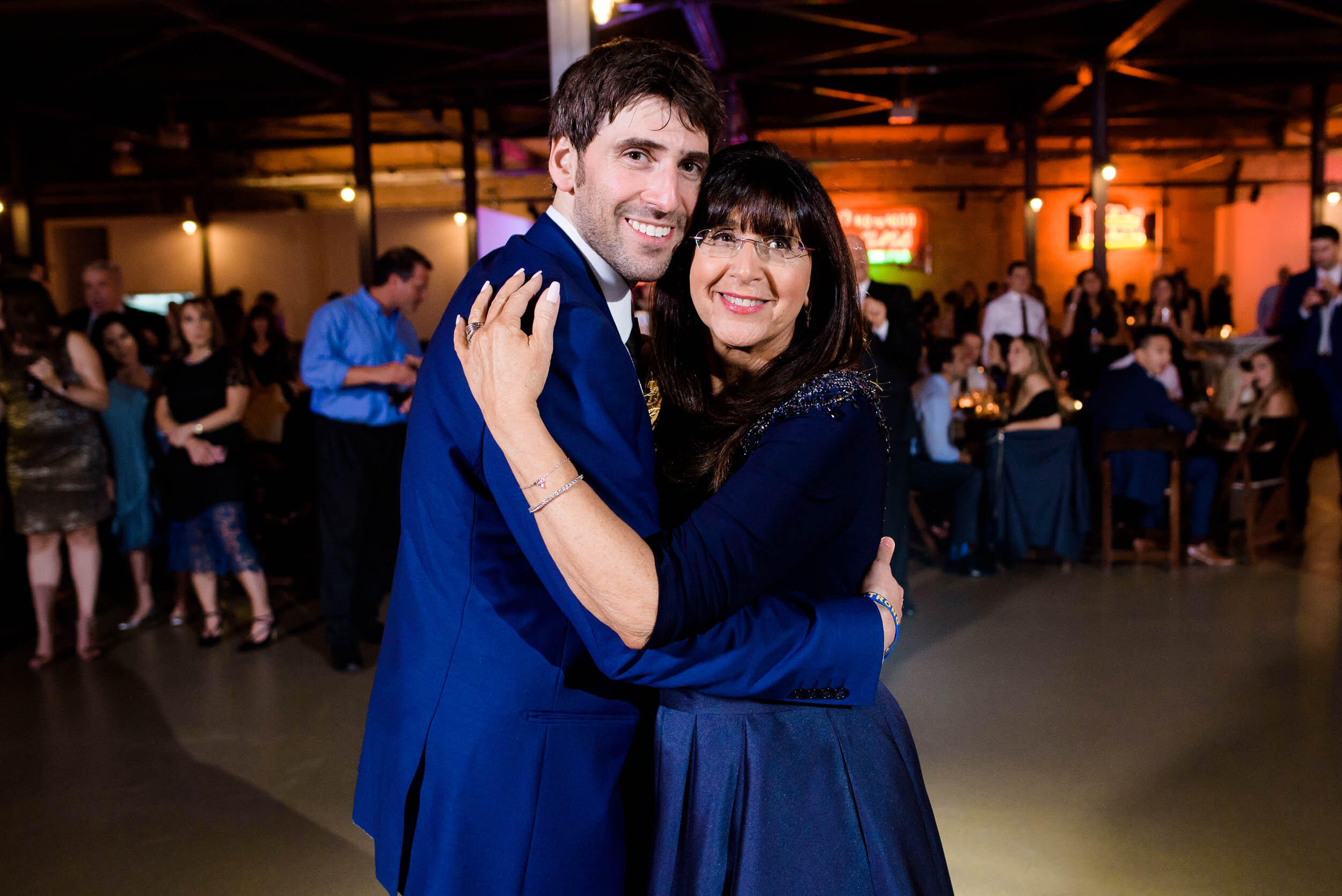 Groom and mom dance at the reception: Ravenswood Event Center Chicago wedding captured by J. Brown Photography.  