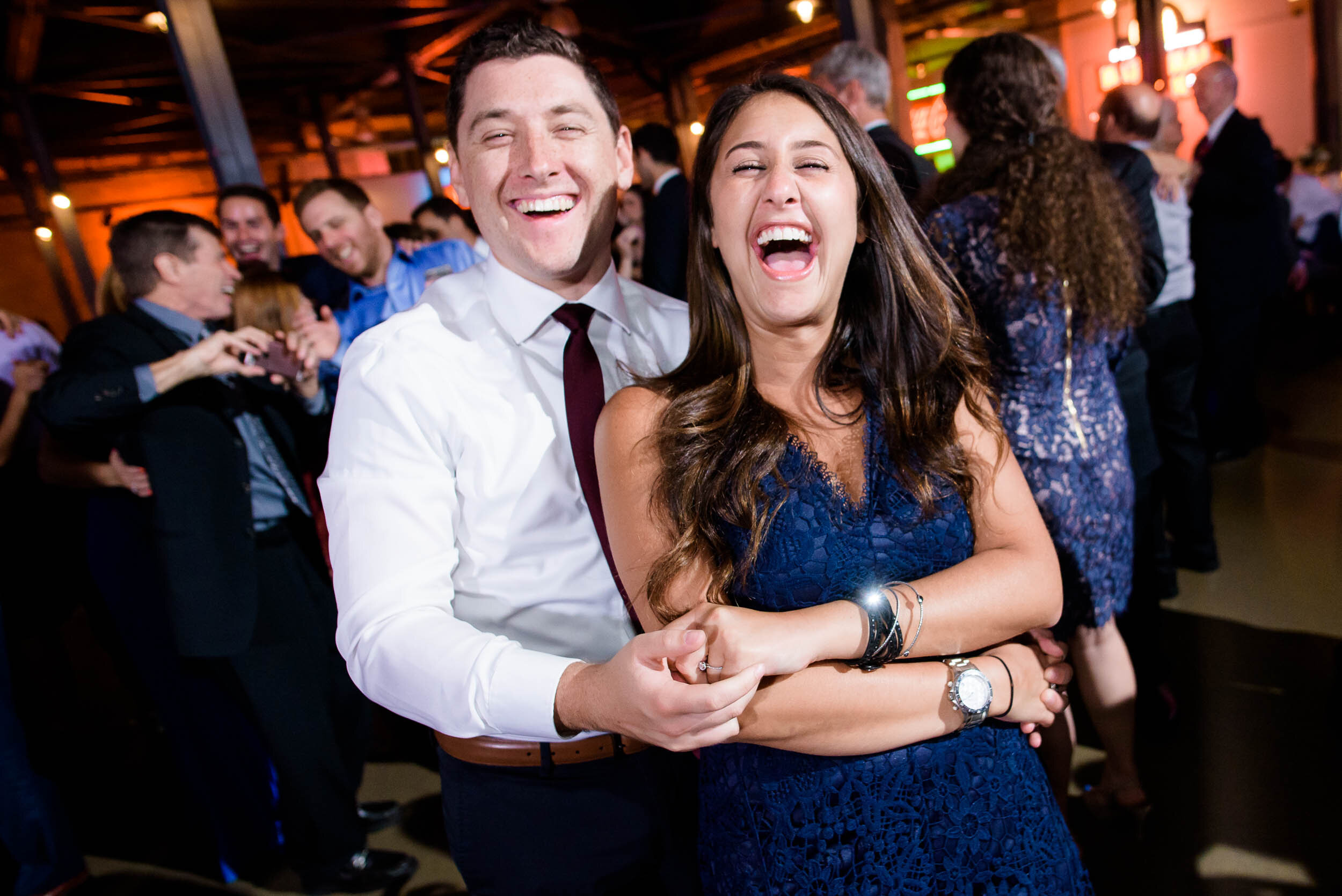 Fun dance floor moment photo: Ravenswood Event Center Chicago wedding captured by J. Brown Photography.  