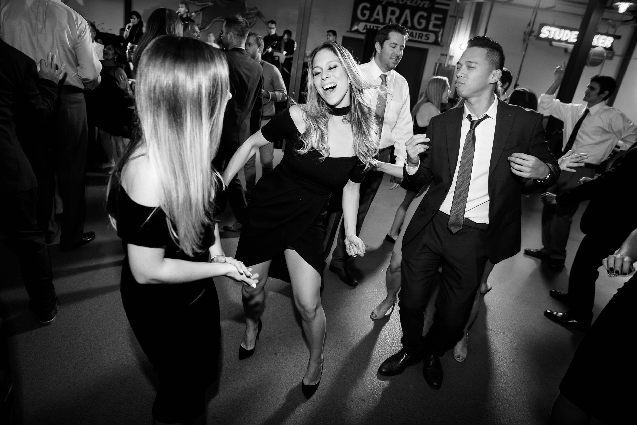 Fun dance floor moment during the wedding reception: Ravenswood Event Center Chicago wedding captured by J. Brown Photography.  
