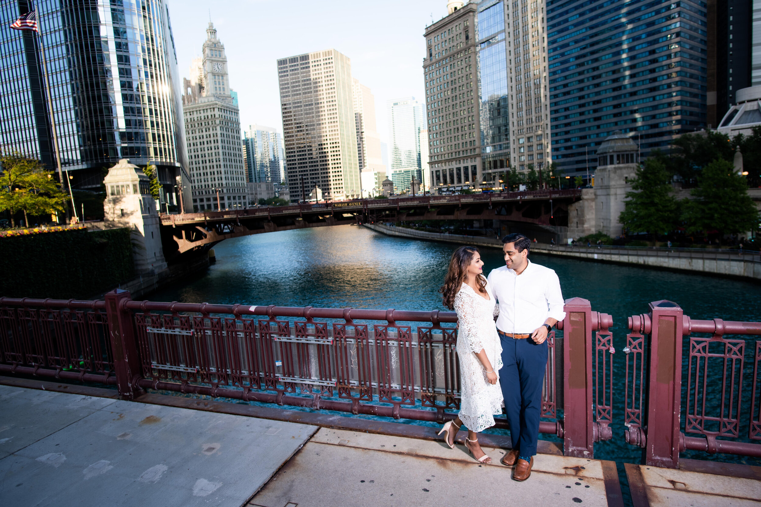 Engagement photo of the bride and groom overlooking the Chicago River. 