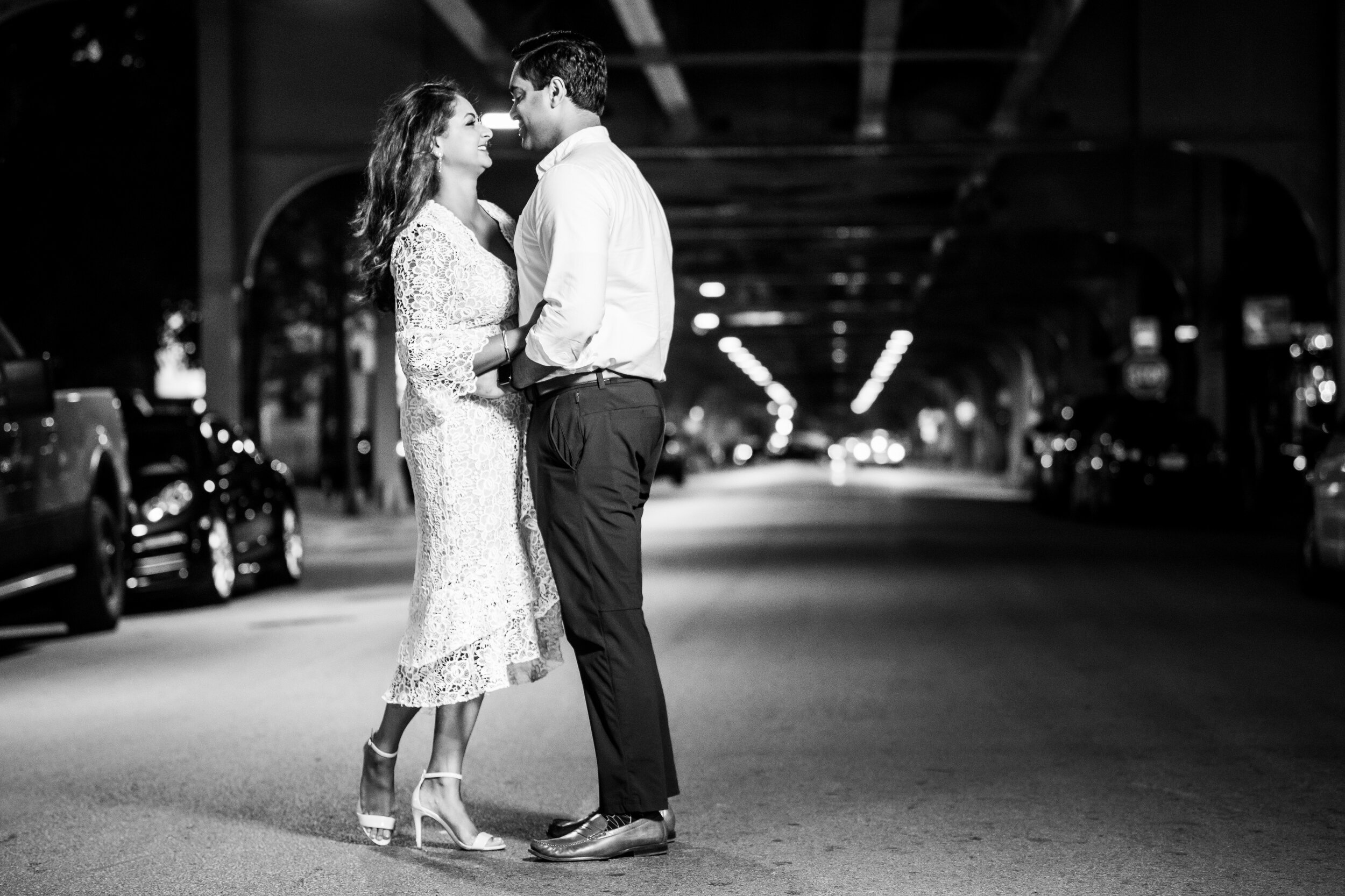 Night engagement photo under the el tracks in Chicago. 