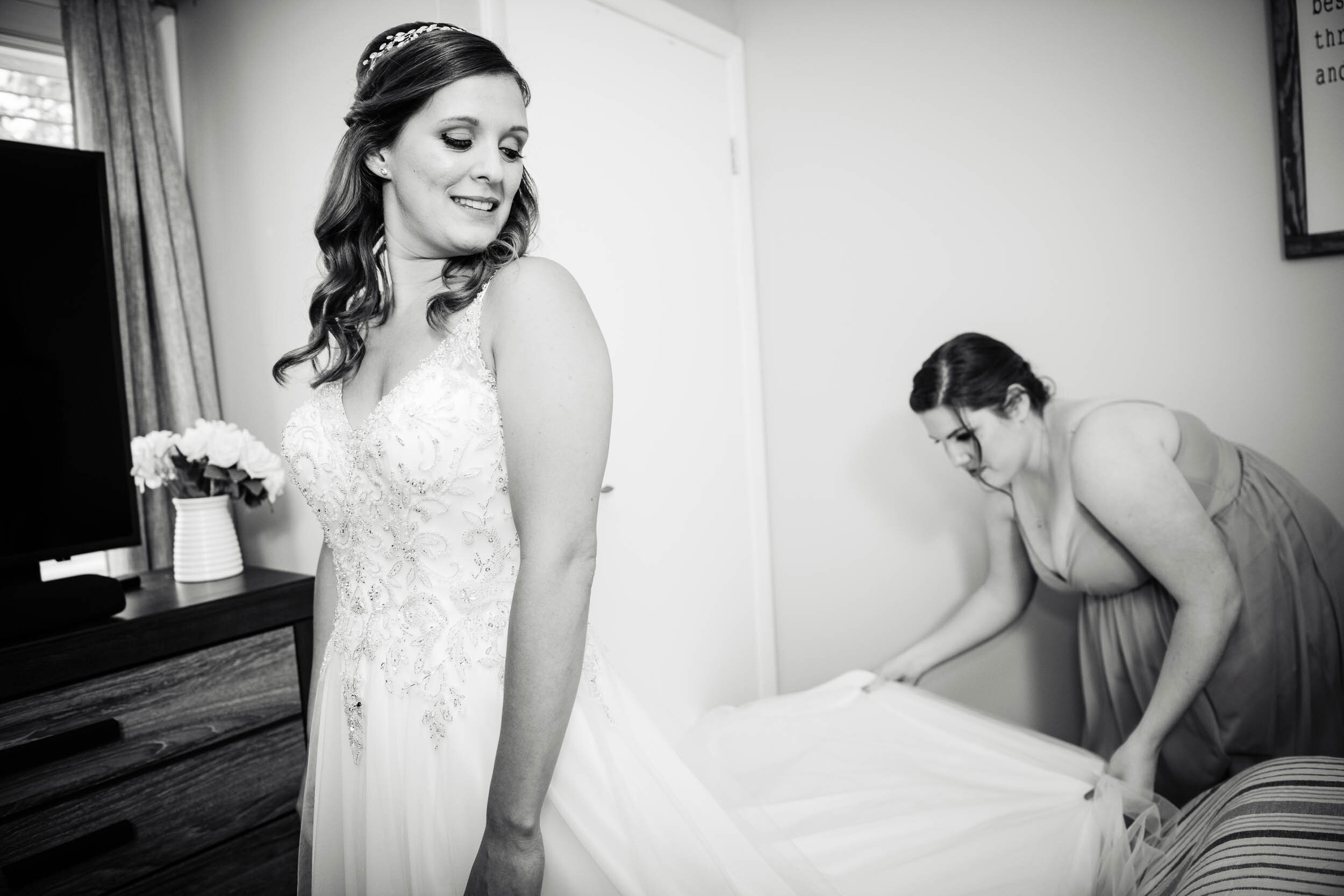 Bride and maid of honor getting ready on the wedding day:  Chicago backyard wedding photographed by J. Brown Photography.