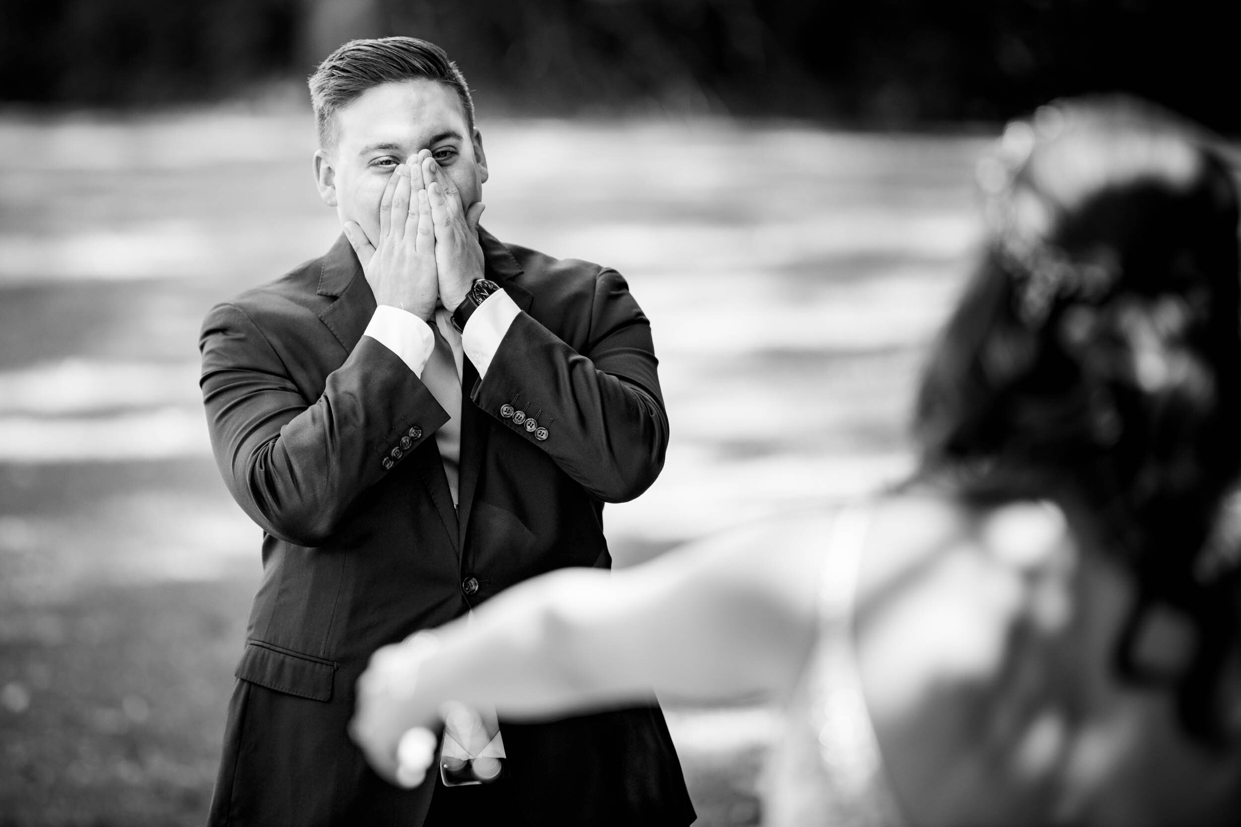 Groom gets emotional during the first look on the wedding day:  Chicago backyard wedding photographed by J. Brown Photography.
