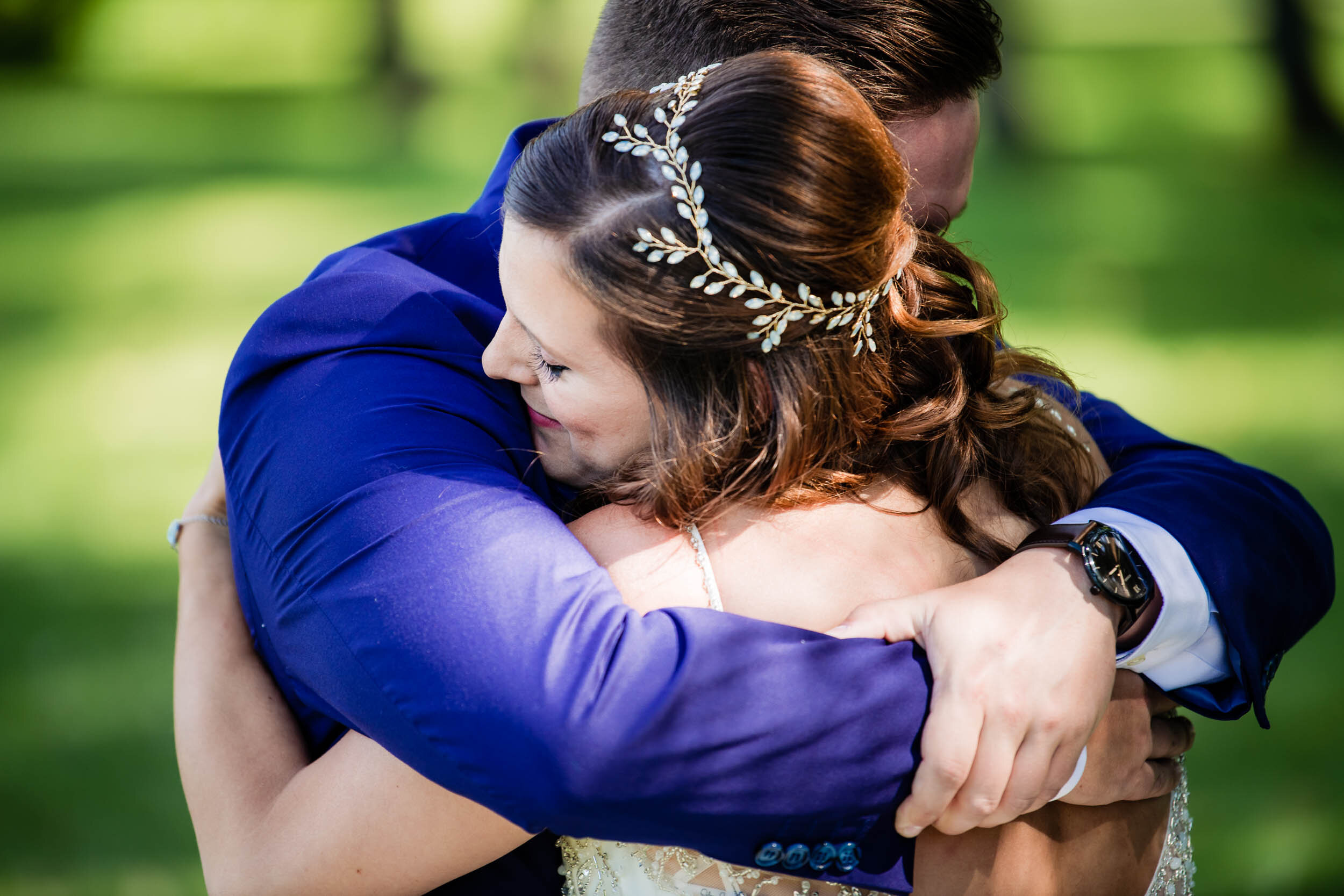 Bride and groom embrace during the first look:  Chicago backyard wedding photographed by J. Brown Photography.