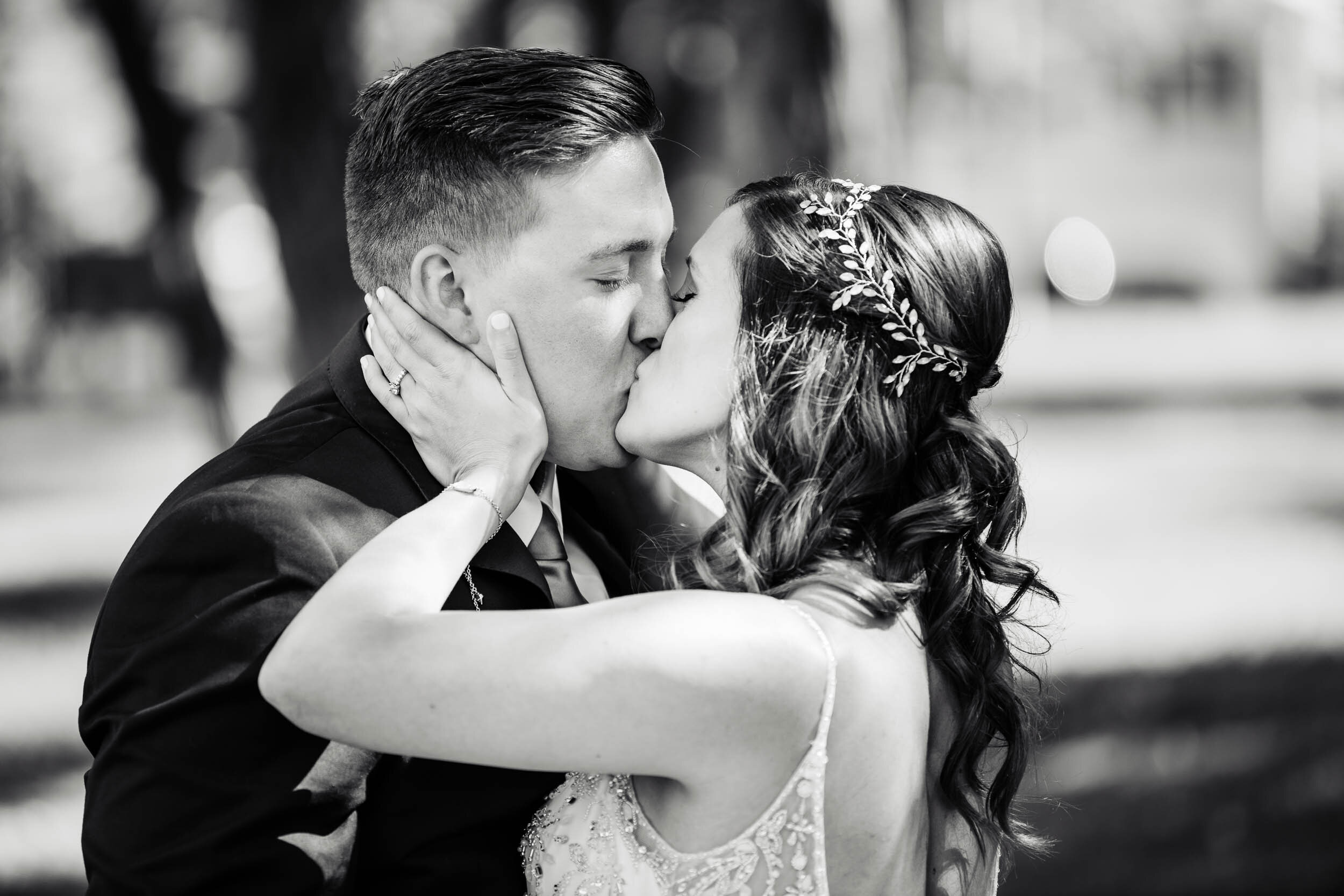 Bride and groom kiss during the first look:  Chicago backyard wedding photographed by J. Brown Photography.