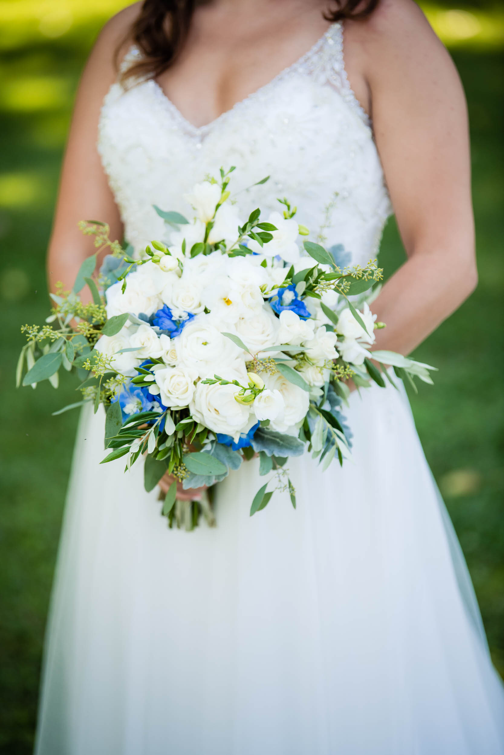Wedding day bridal portrait with flowers:  Chicago backyard wedding photographed by J. Brown Photography.