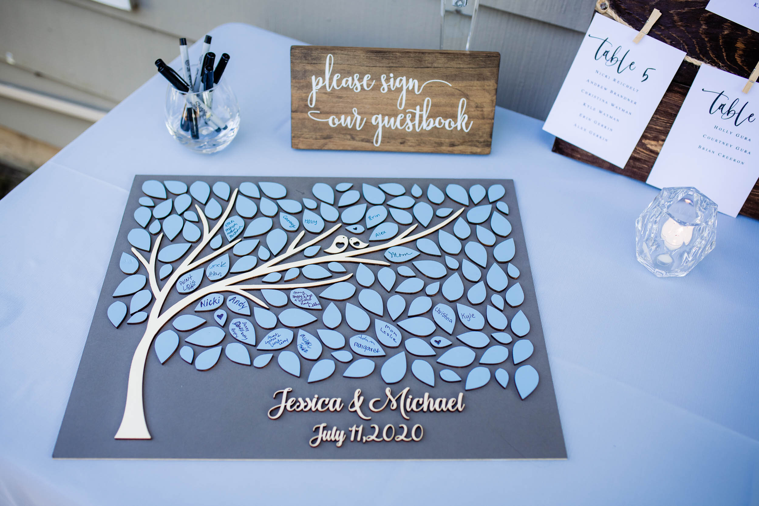 Creative sign in table:  Chicago backyard wedding photographed by J. Brown Photography.