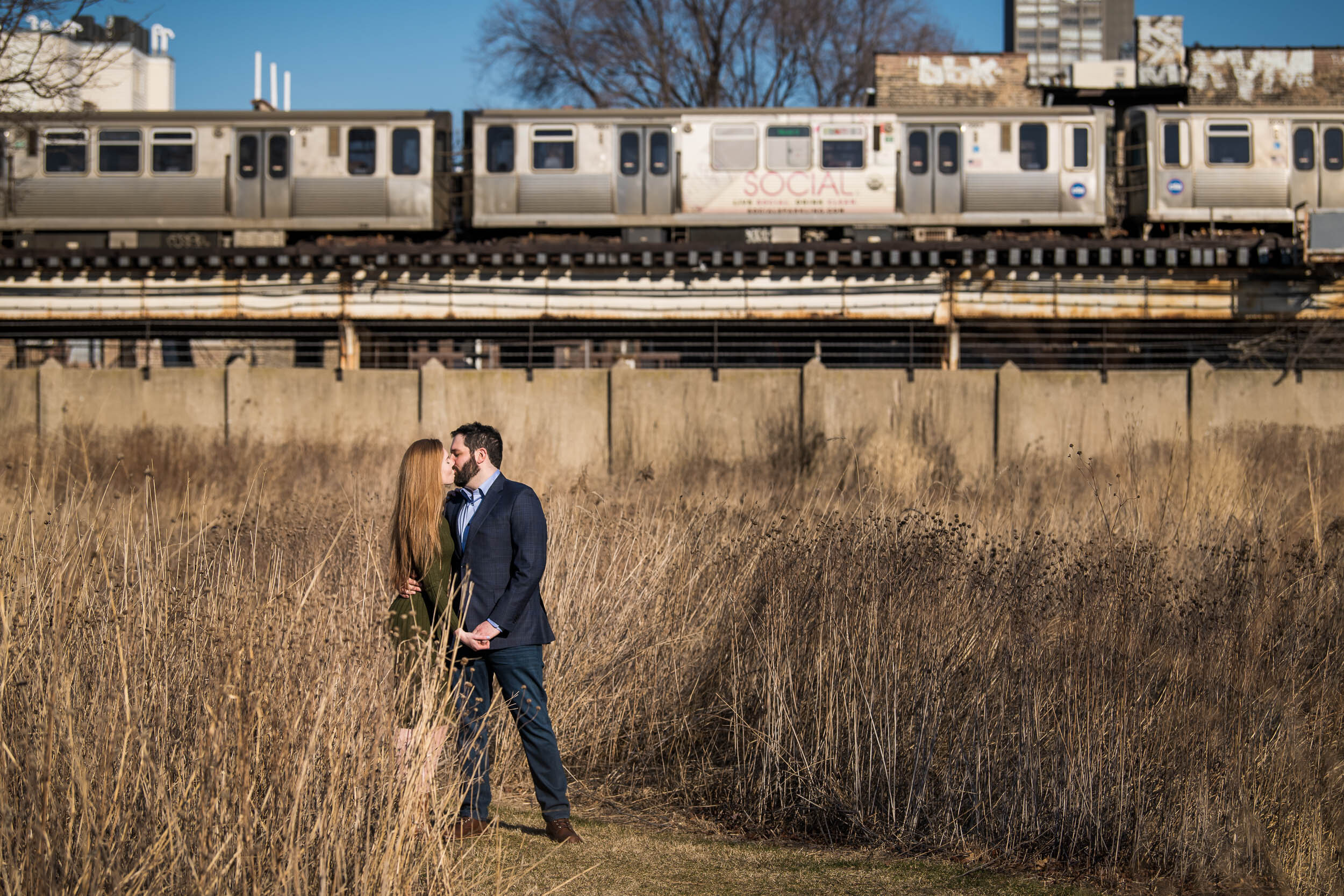 Bride and groom kiss at Graceland Cemetery:  Chicago engagement photo by J. Brown Photography.